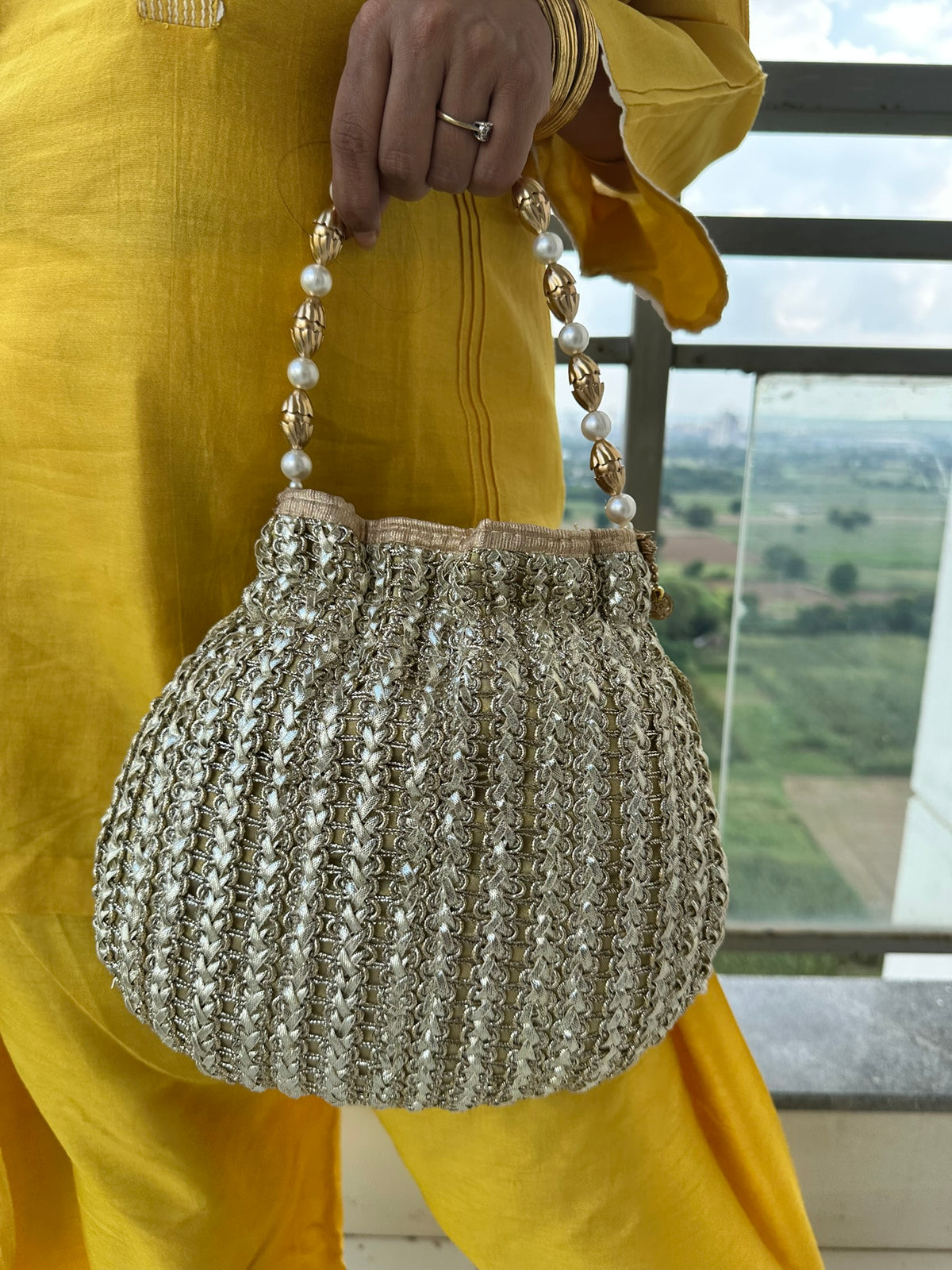 The CHANDNI Coin & Tassel Potli Collection
