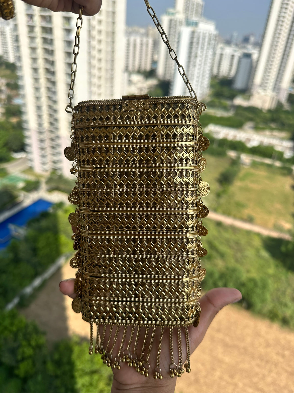 The MEERA Handcrafted Gold Filigree Phone Crossbody Clutch with Coin Charms