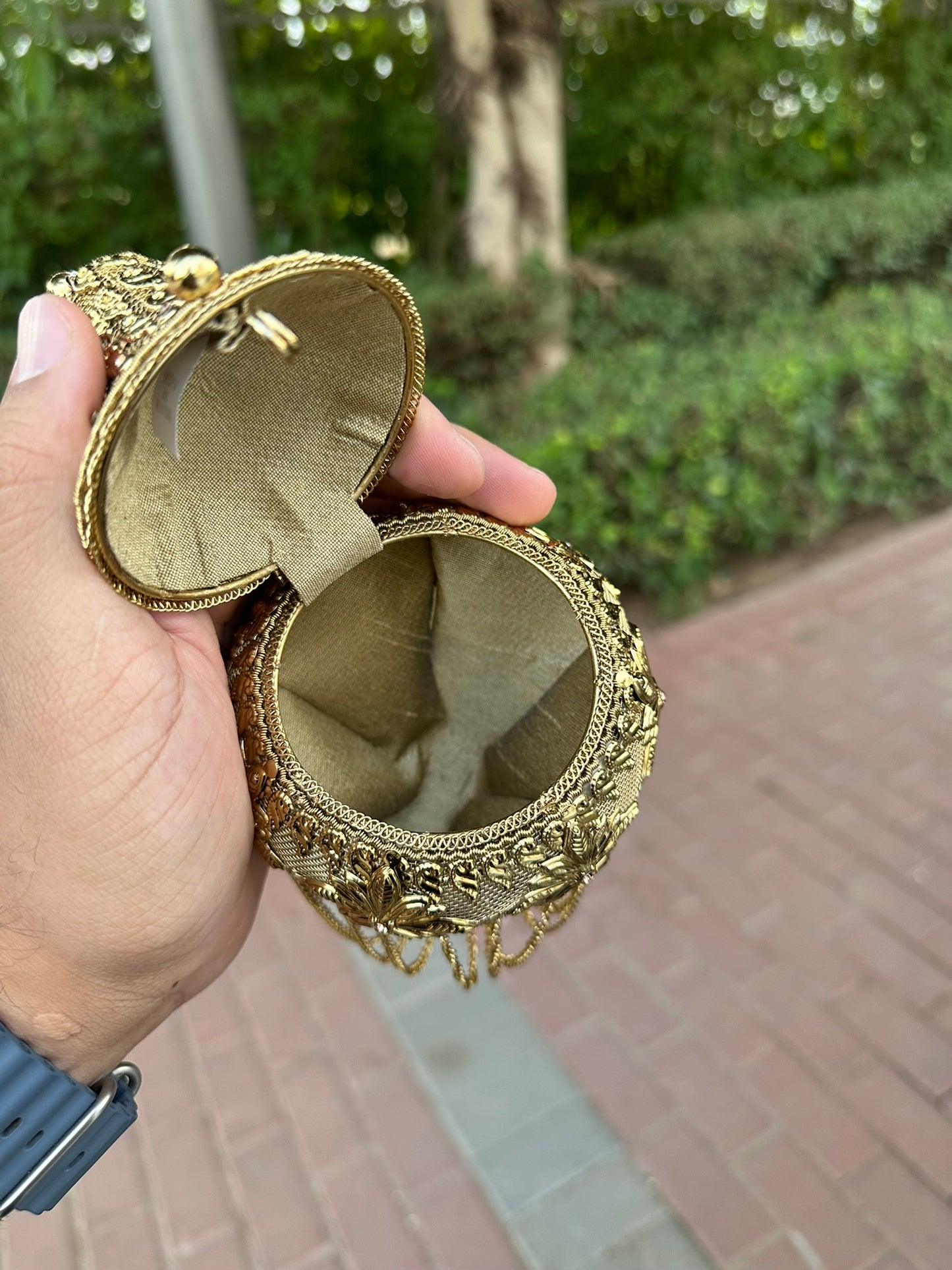 Gold Filigree Mini Potli Clutch - Vintage-Inspired Metal Minaudière with Floral Detail and Fringe Tassels