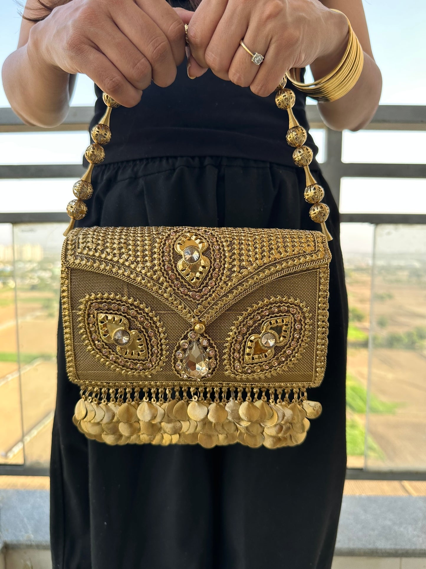 The Aria Antique Gold Embroidered Clutch with Statement Ghungroo Drops