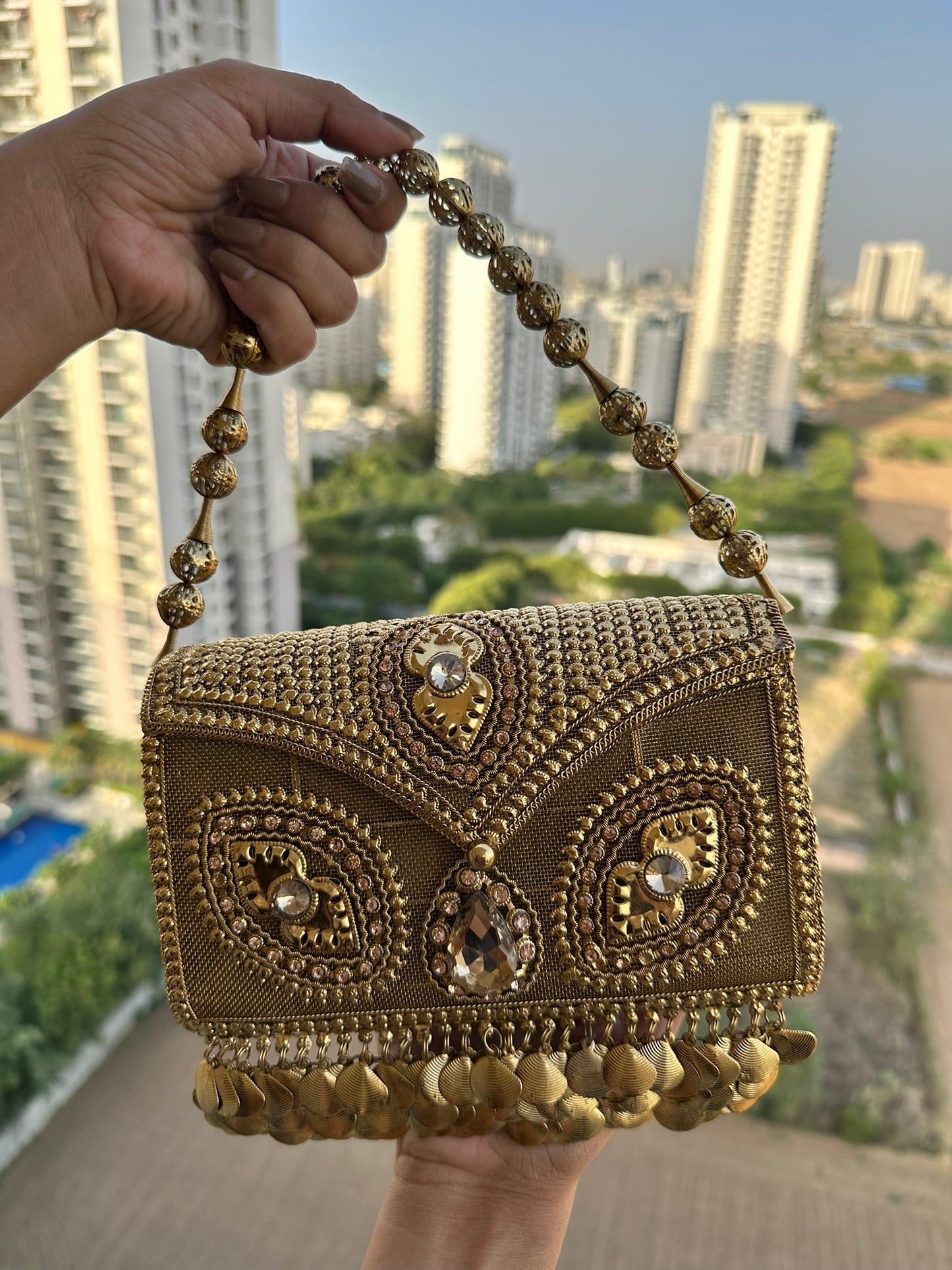 The Aria Antique Gold Embroidered Clutch with Statement Ghungroo Drops