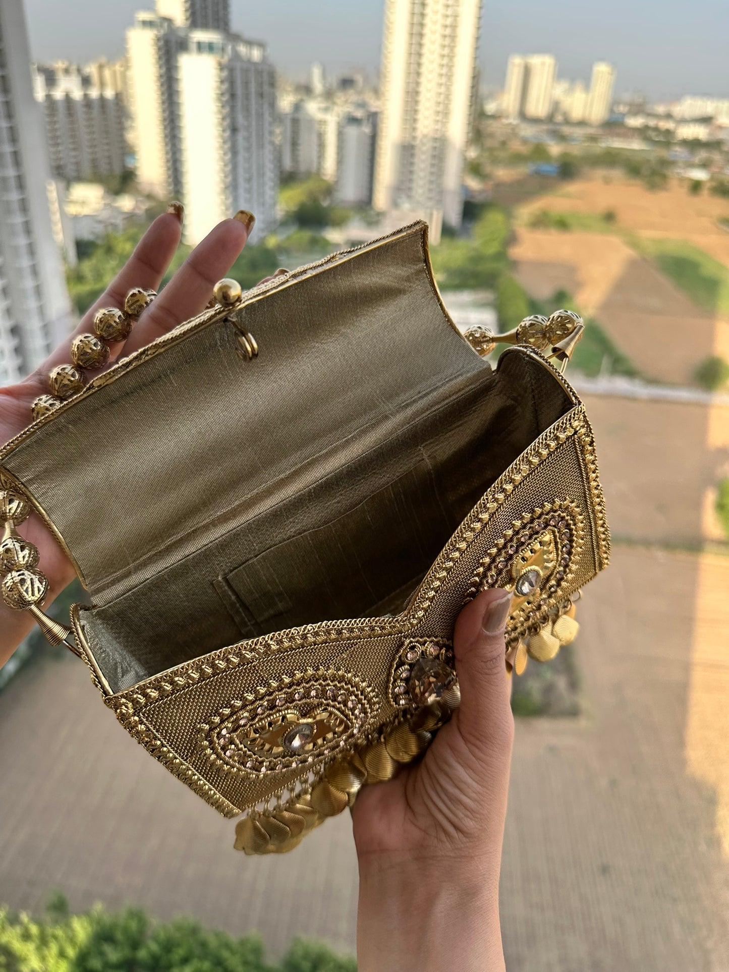 The Aria Antique Gold Embroidered Clutch with Statement Ghungroo Drops