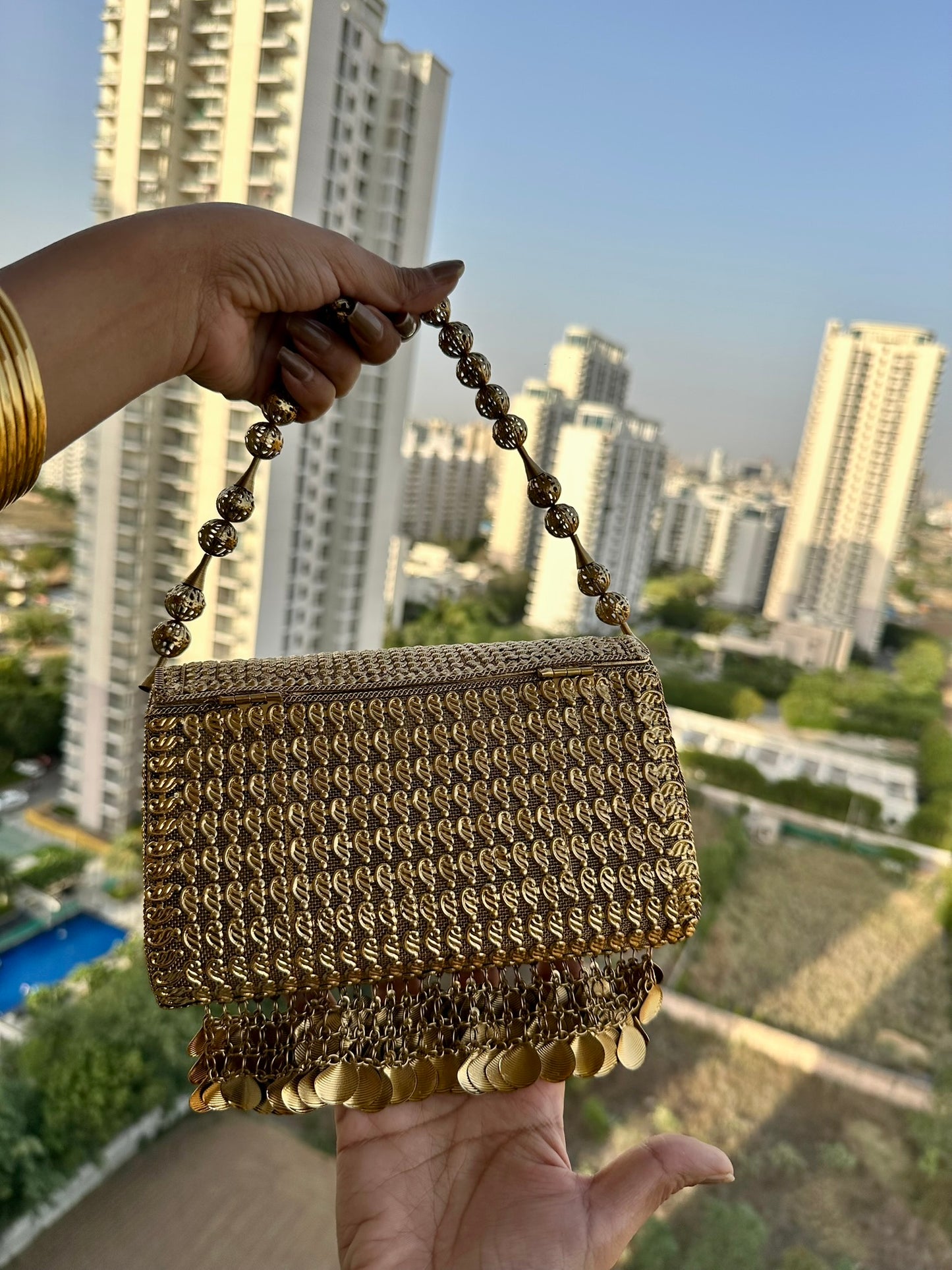 The Aria Antique Gold Embroidered Clutch with Statement Ghungroo Drops