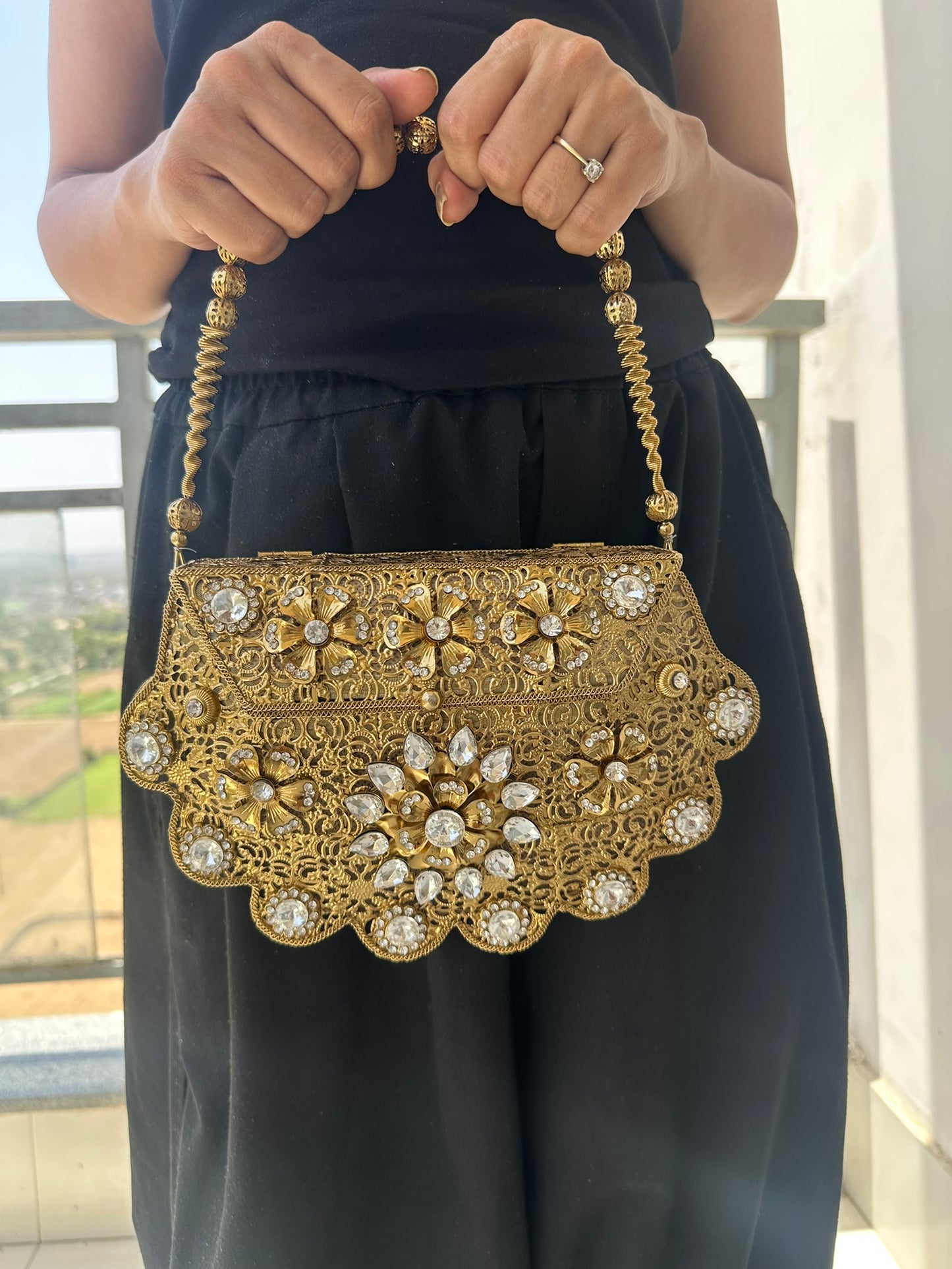 The Antique Gold Scalloped Filigree Clutch with Crystal Floral Medallions