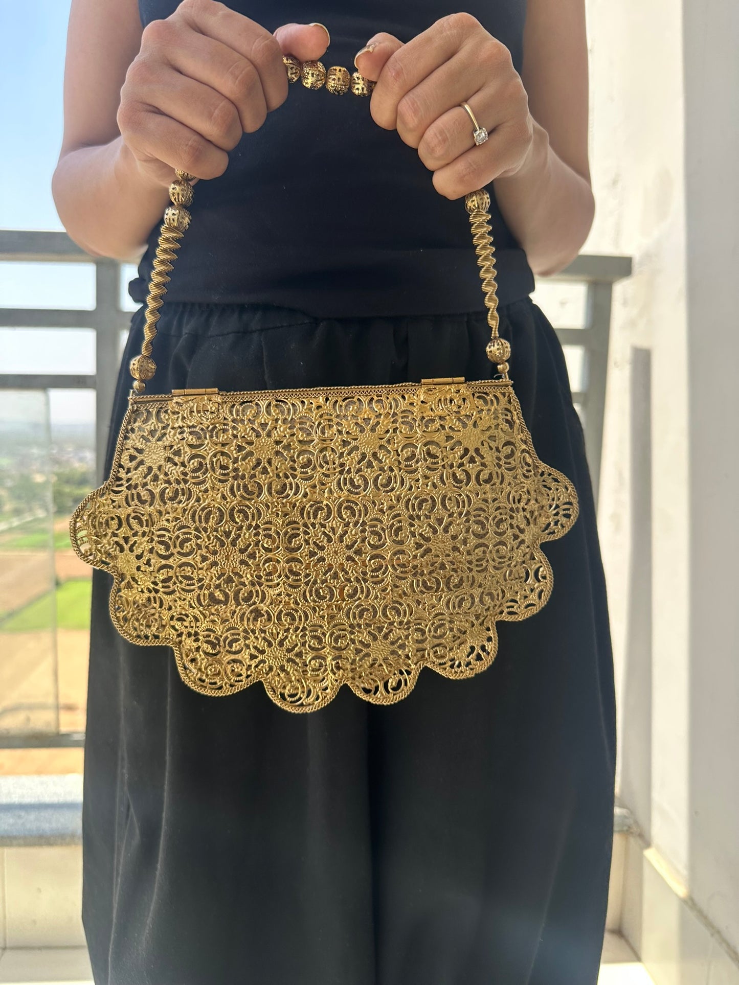 The Antique Gold Scalloped Filigree Clutch with Crystal Floral Medallions