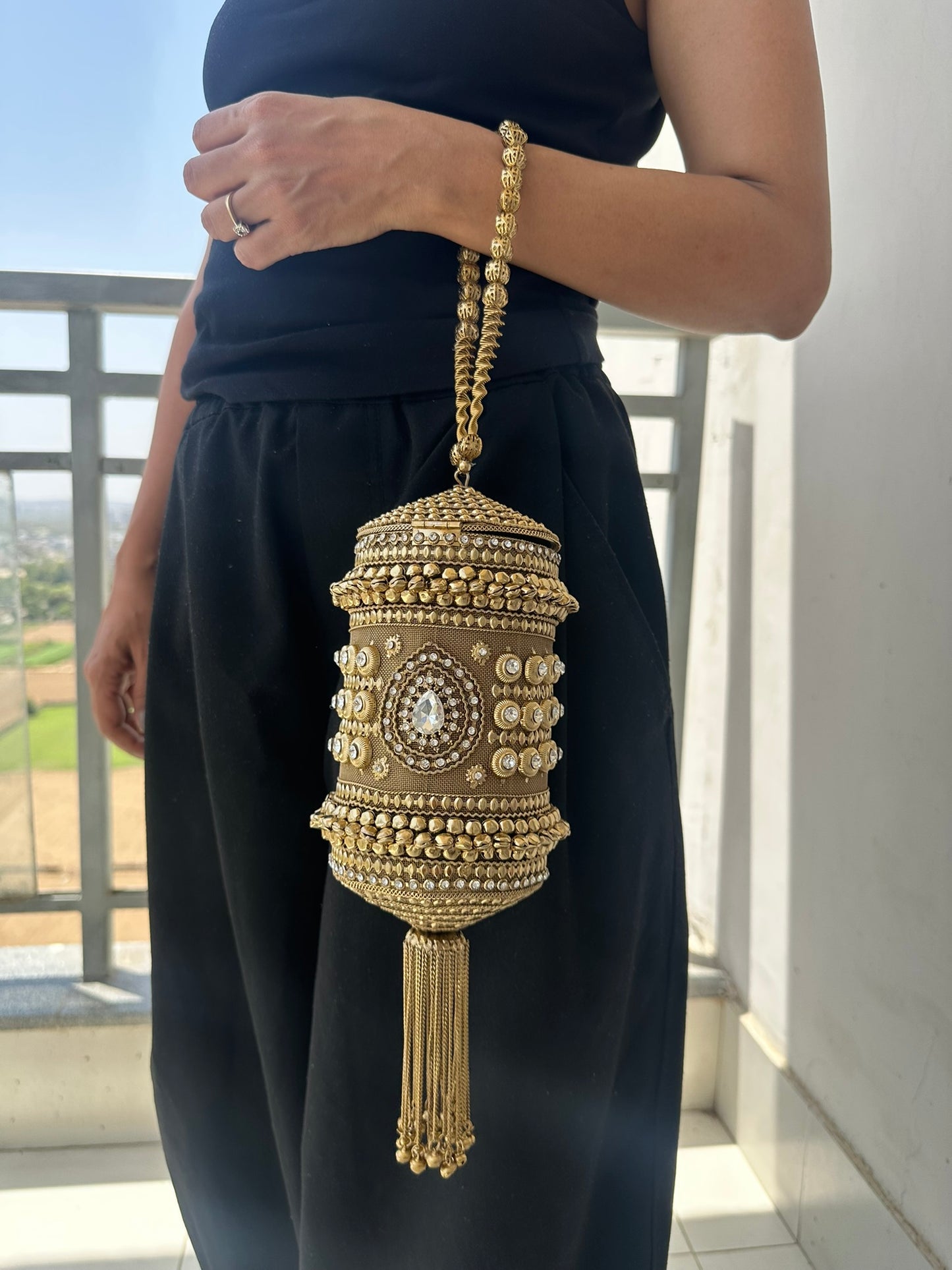 The Zara Antique Gold Cylindrical Capsule Clutch with Statement Tassel