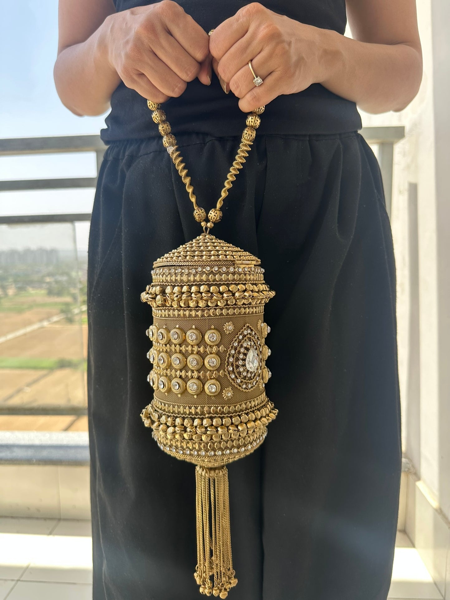 The Zara Antique Gold Cylindrical Capsule Clutch with Statement Tassel