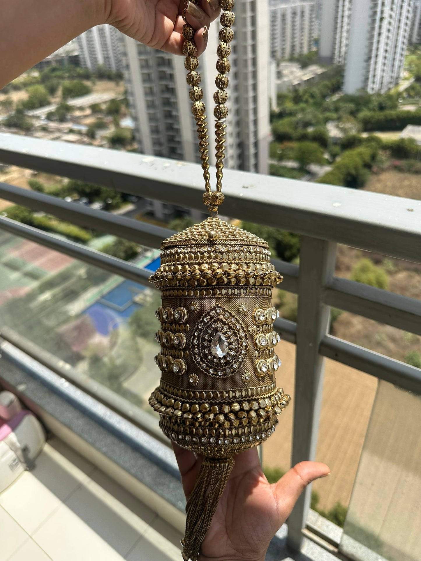 The Zara Antique Gold Cylindrical Capsule Clutch with Statement Tassel