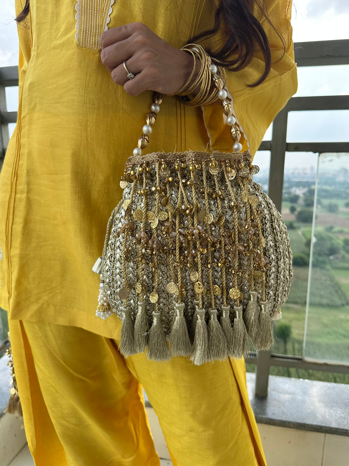 The CHANDNI Coin & Tassel Potli Collection