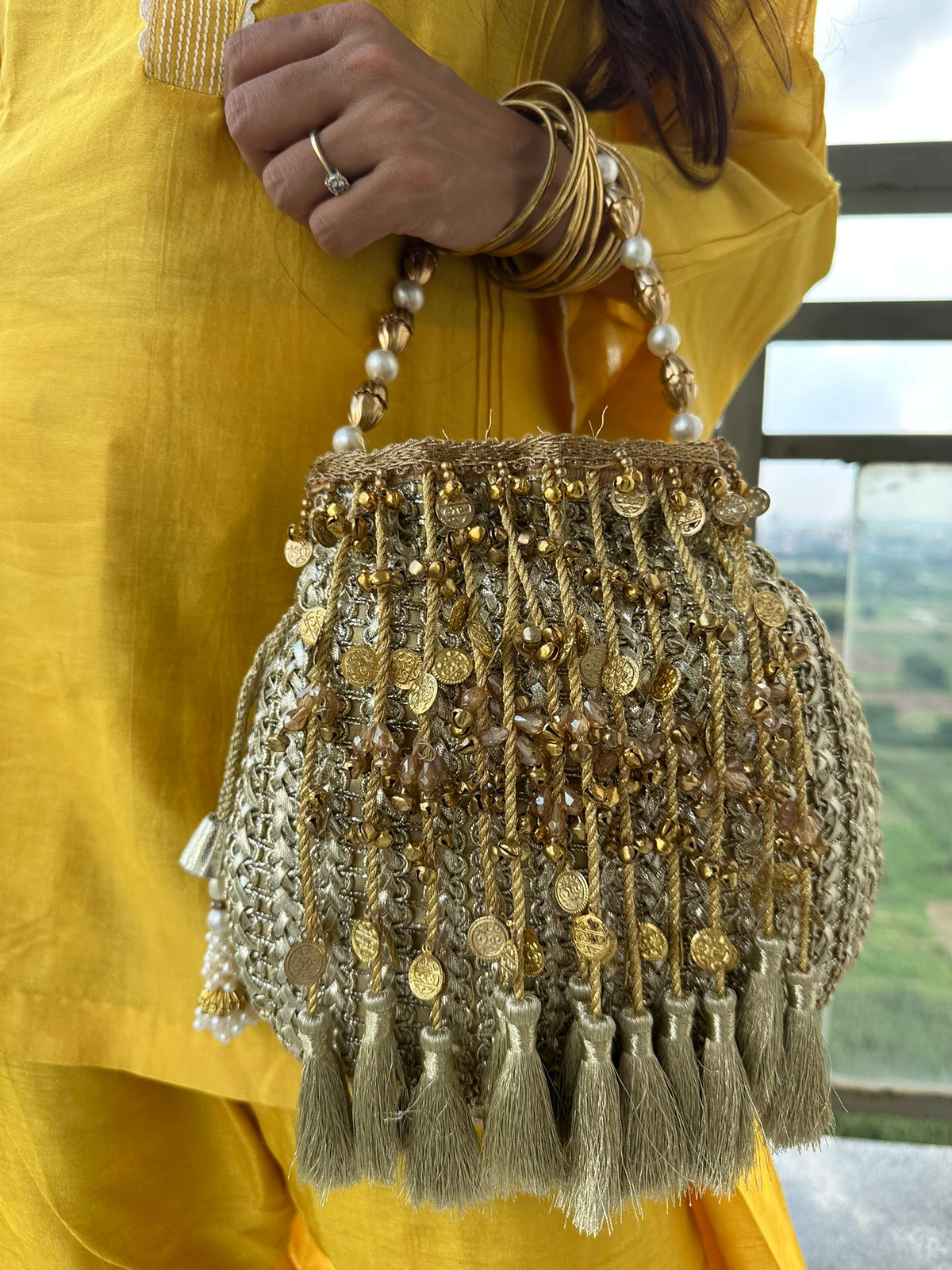 The CHANDNI Coin & Tassel Potli Collection