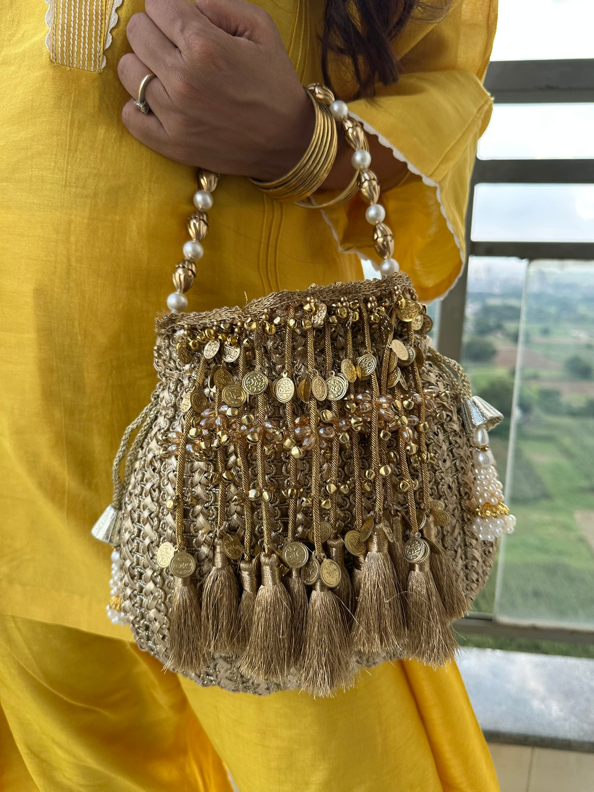 The CHANDNI Coin & Tassel Potli Collection