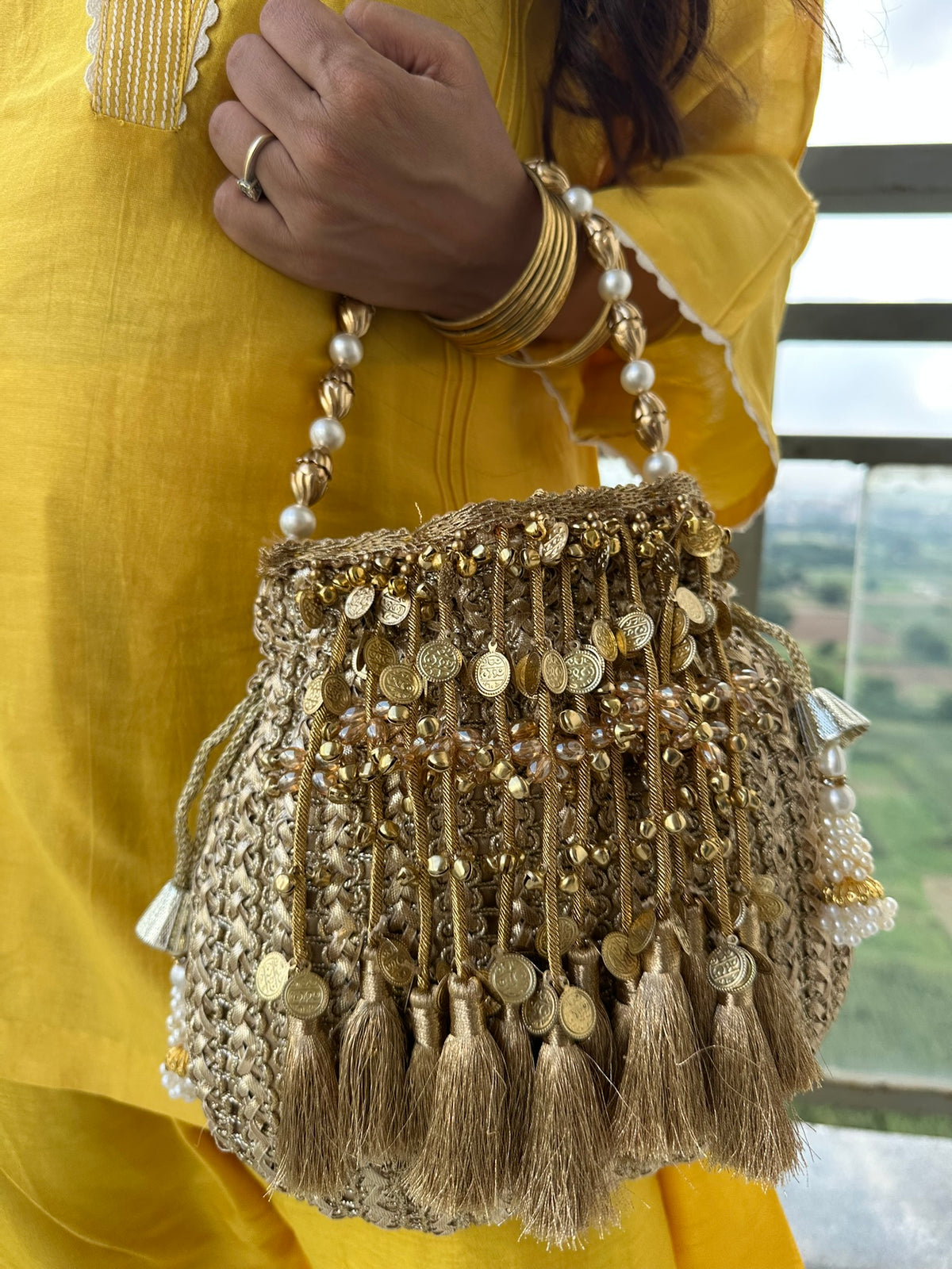 The CHANDNI Coin & Tassel Potli Collection