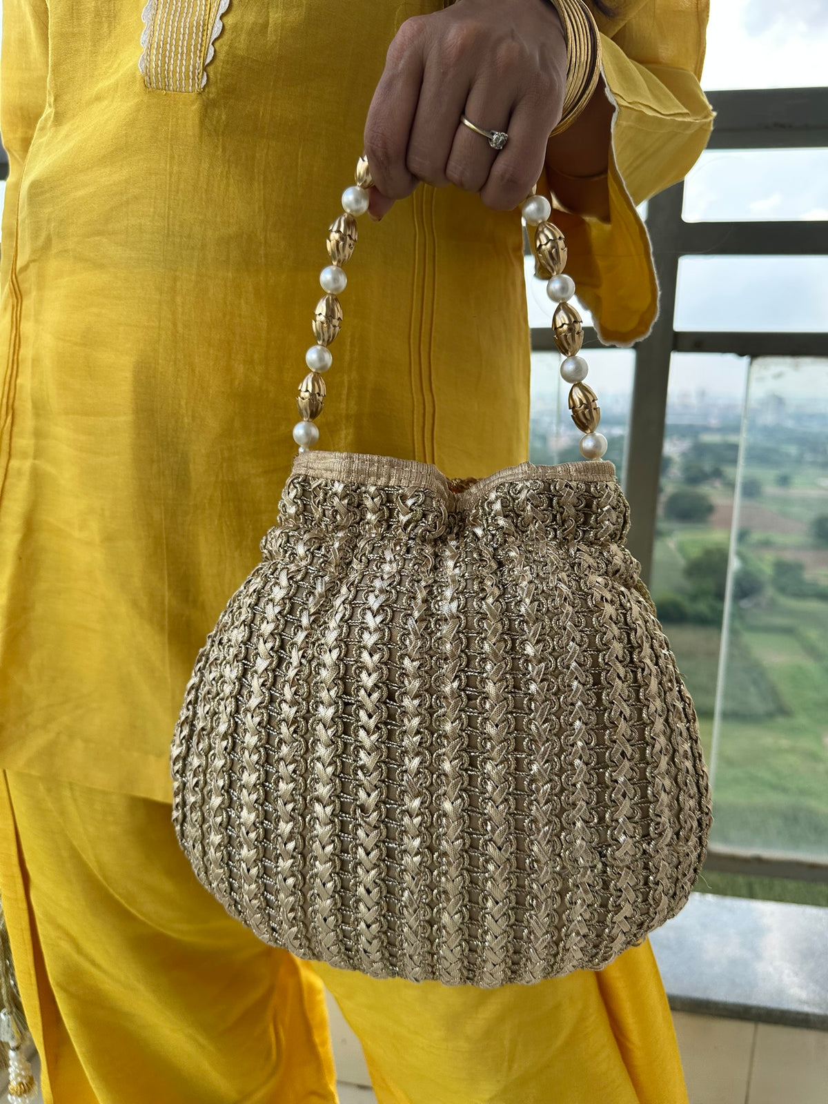 The CHANDNI Coin & Tassel Potli Collection