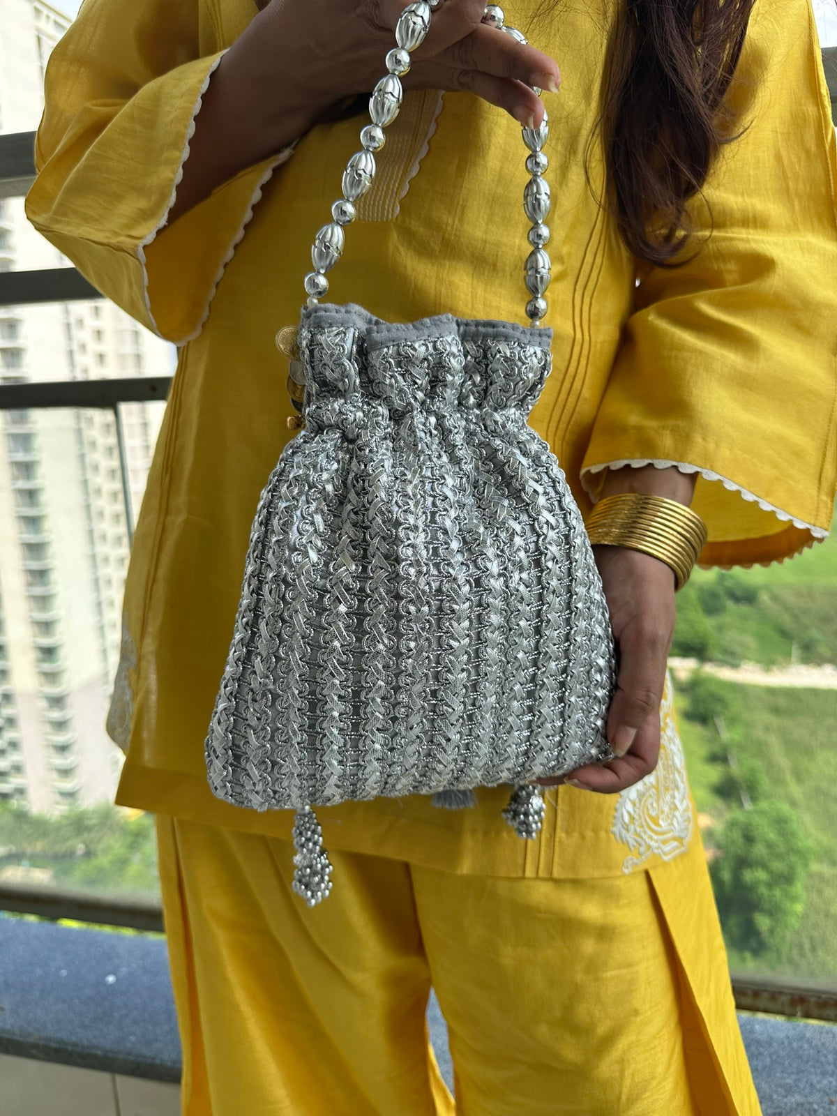 The CHANDNI Coin & Tassel Potli Collection