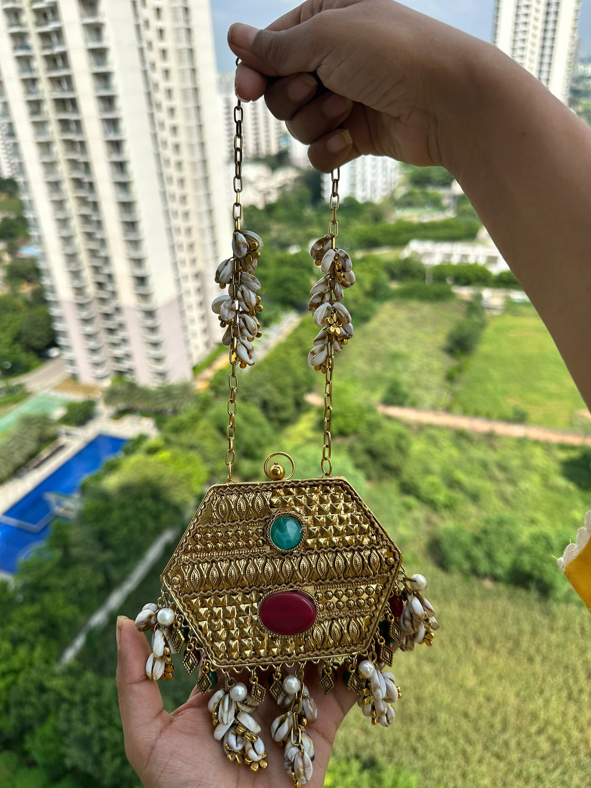 The MAYA Hexagon Clutch - Gold Gemstone & Cowrie Shell Metal Minaudière | Emerald & Ruby Stone Evening Bag with Shell Chain | Boho Tribal Purse