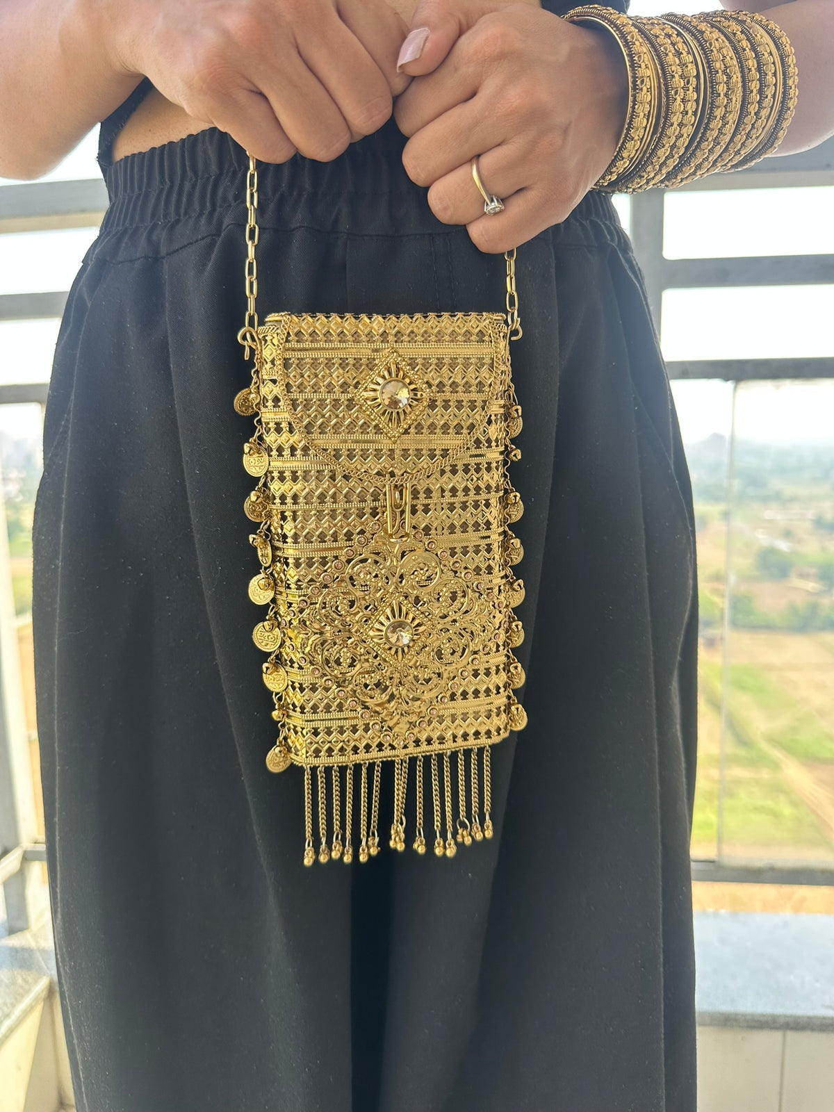 The MEERA Handcrafted Gold Filigree Phone Crossbody Clutch with Coin Charms