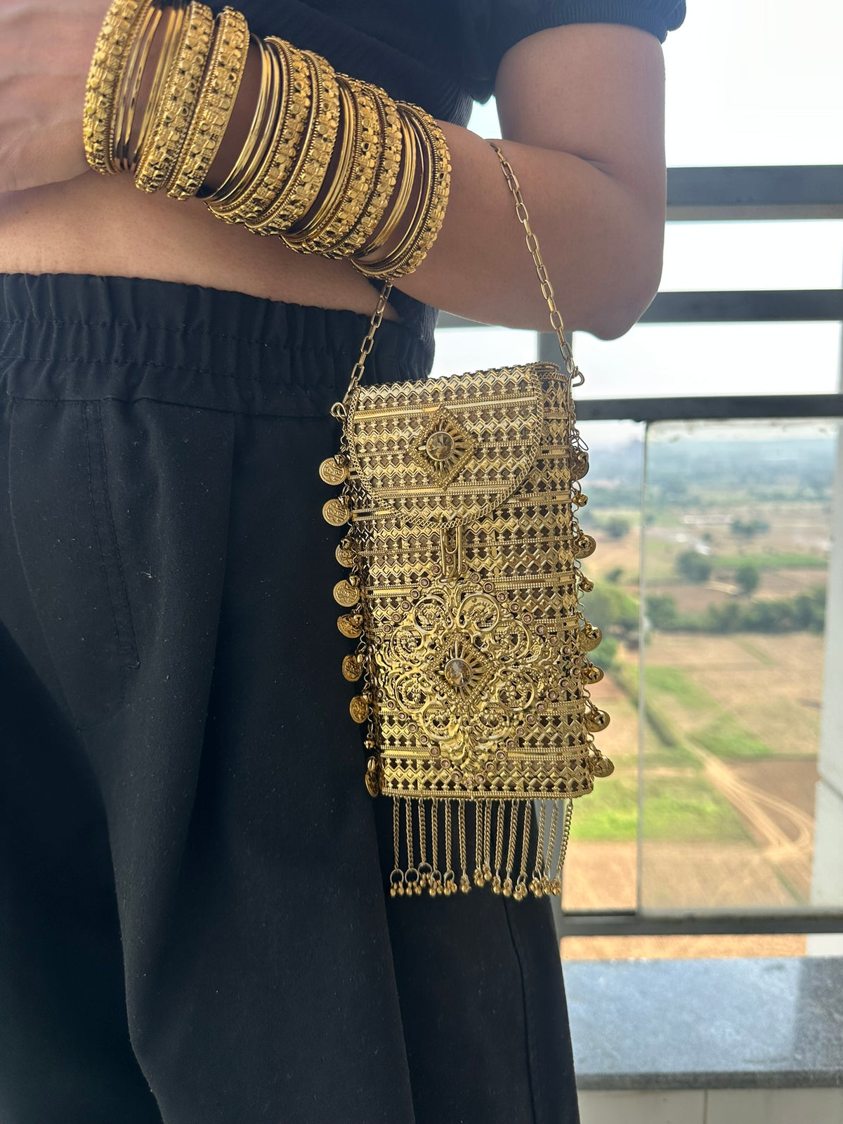 The MEERA Handcrafted Gold Filigree Phone Crossbody Clutch with Coin Charms