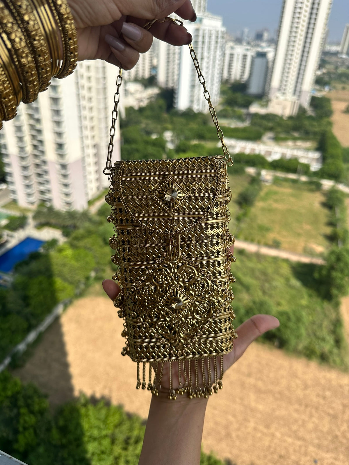 The MEERA Handcrafted Gold Filigree Phone Crossbody Clutch with Coin Charms