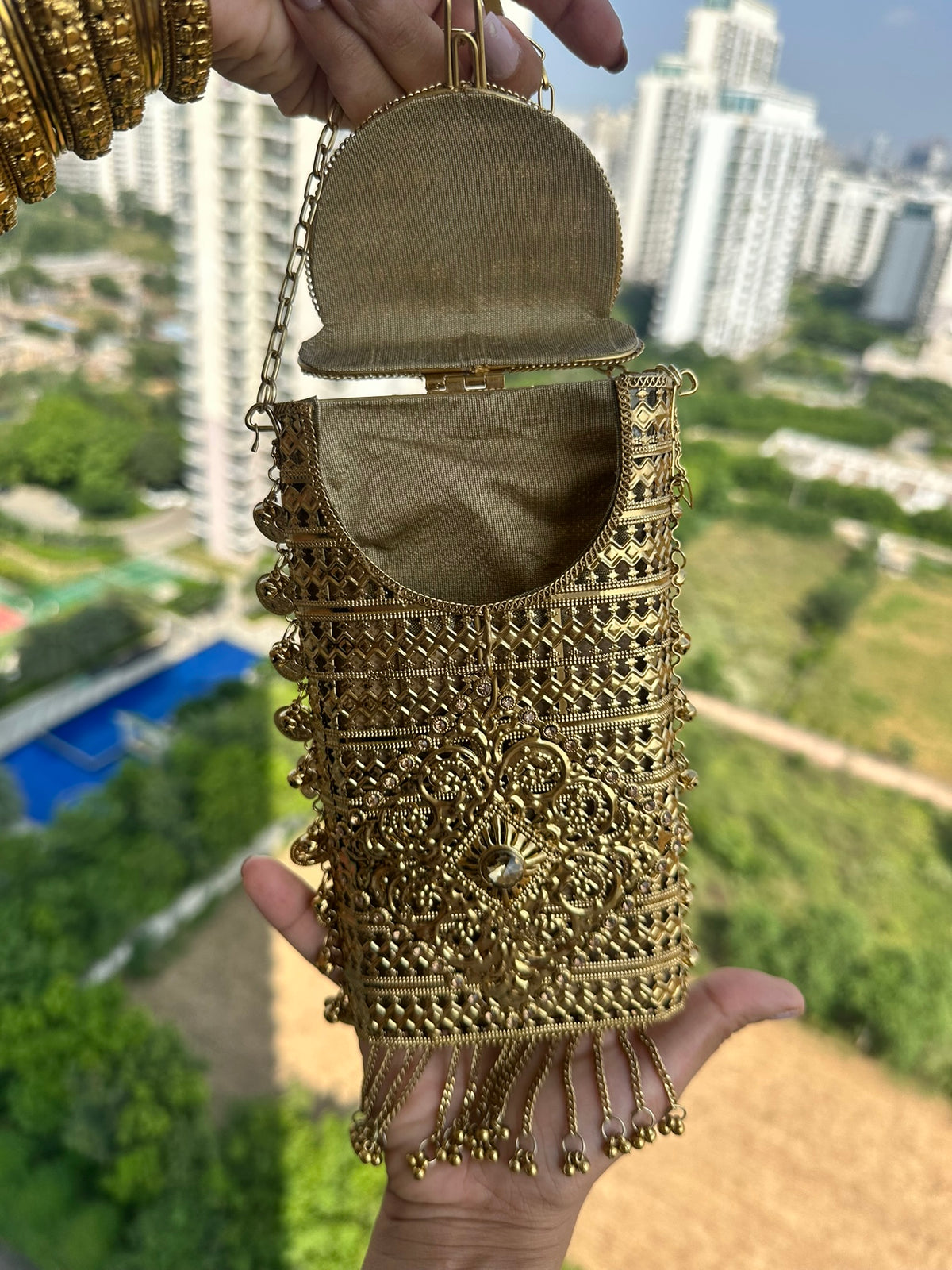 The MEERA Handcrafted Gold Filigree Phone Crossbody Clutch with Coin Charms