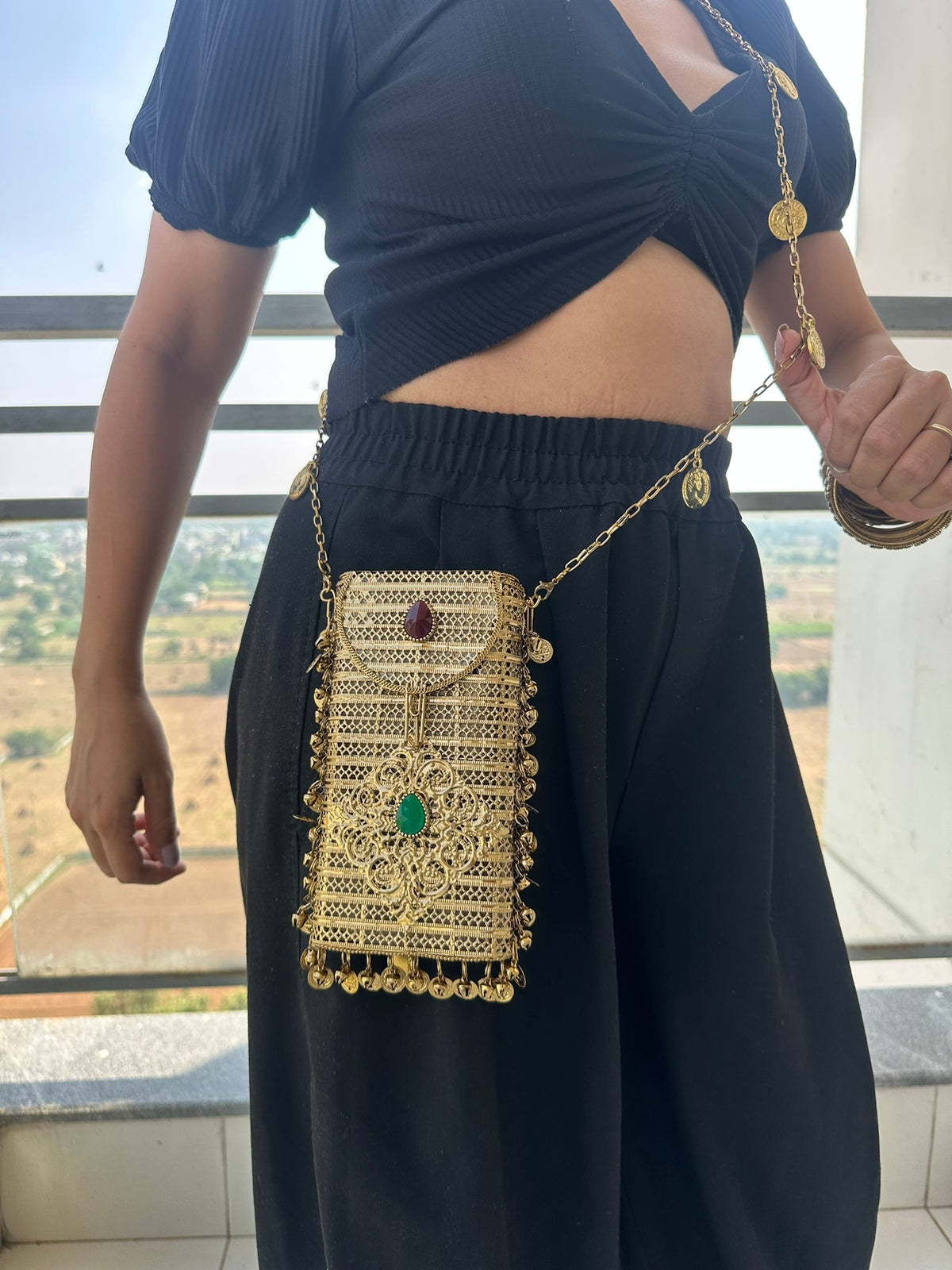 The NAYA Handcrafted Metal Phone Crossbody Clutch with Gemstones & Coin Charms