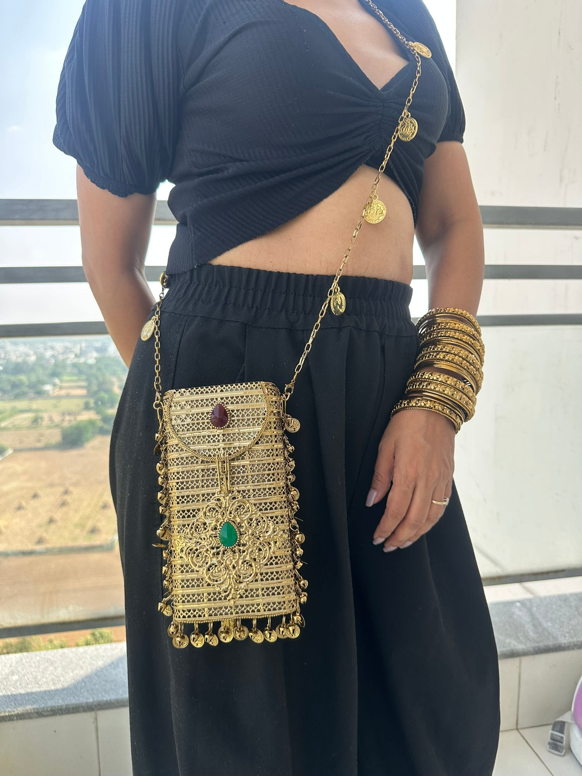 The NAYA Handcrafted Metal Phone Crossbody Clutch with Gemstones & Coin Charms