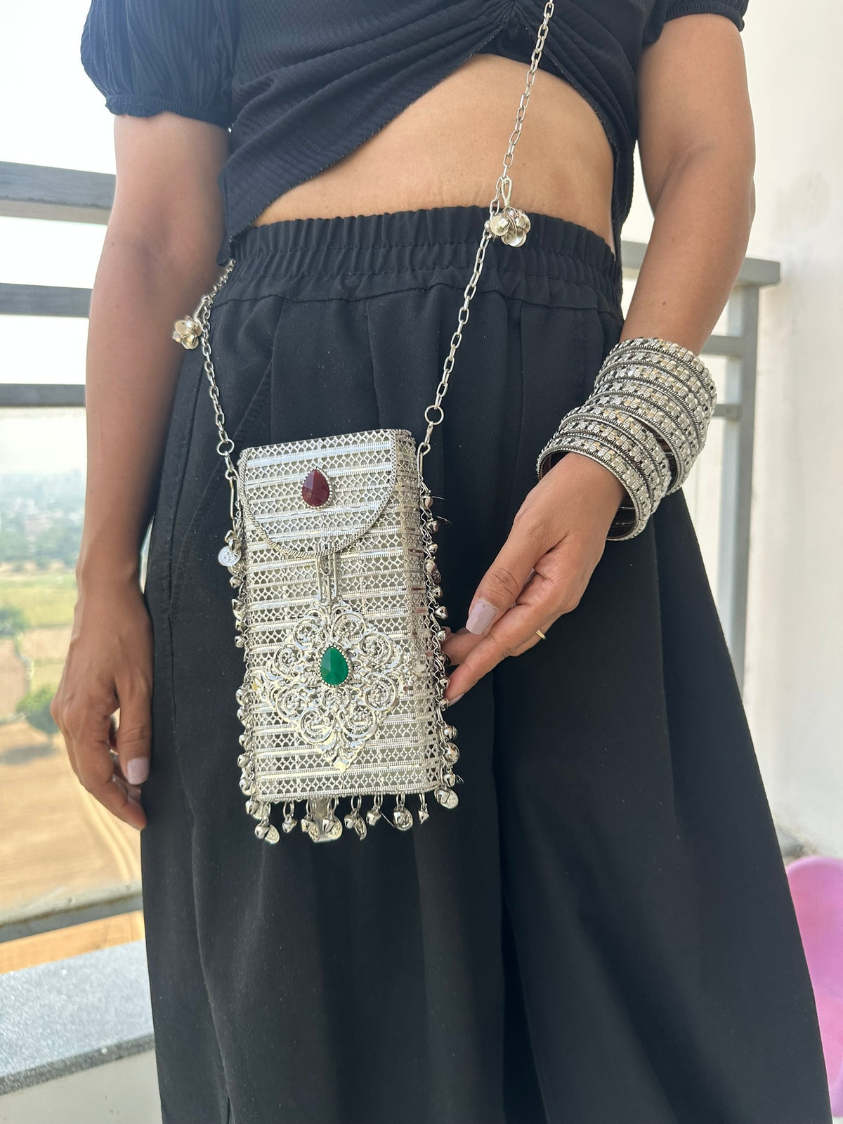 The NAYA Handcrafted Metal Phone Crossbody Clutch with Gemstones & Coin Charms