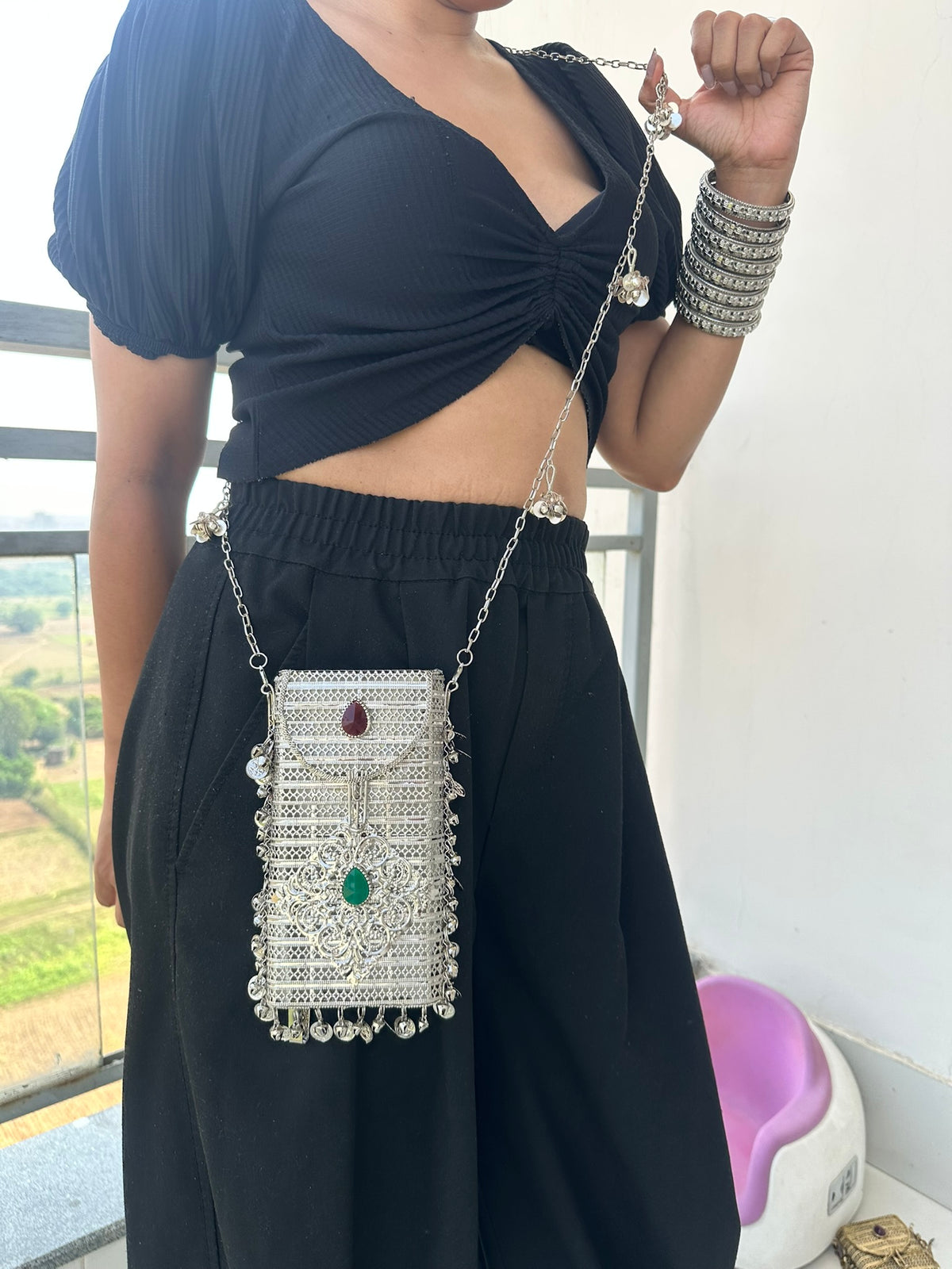 The NAYA Handcrafted Metal Phone Crossbody Clutch with Gemstones & Coin Charms