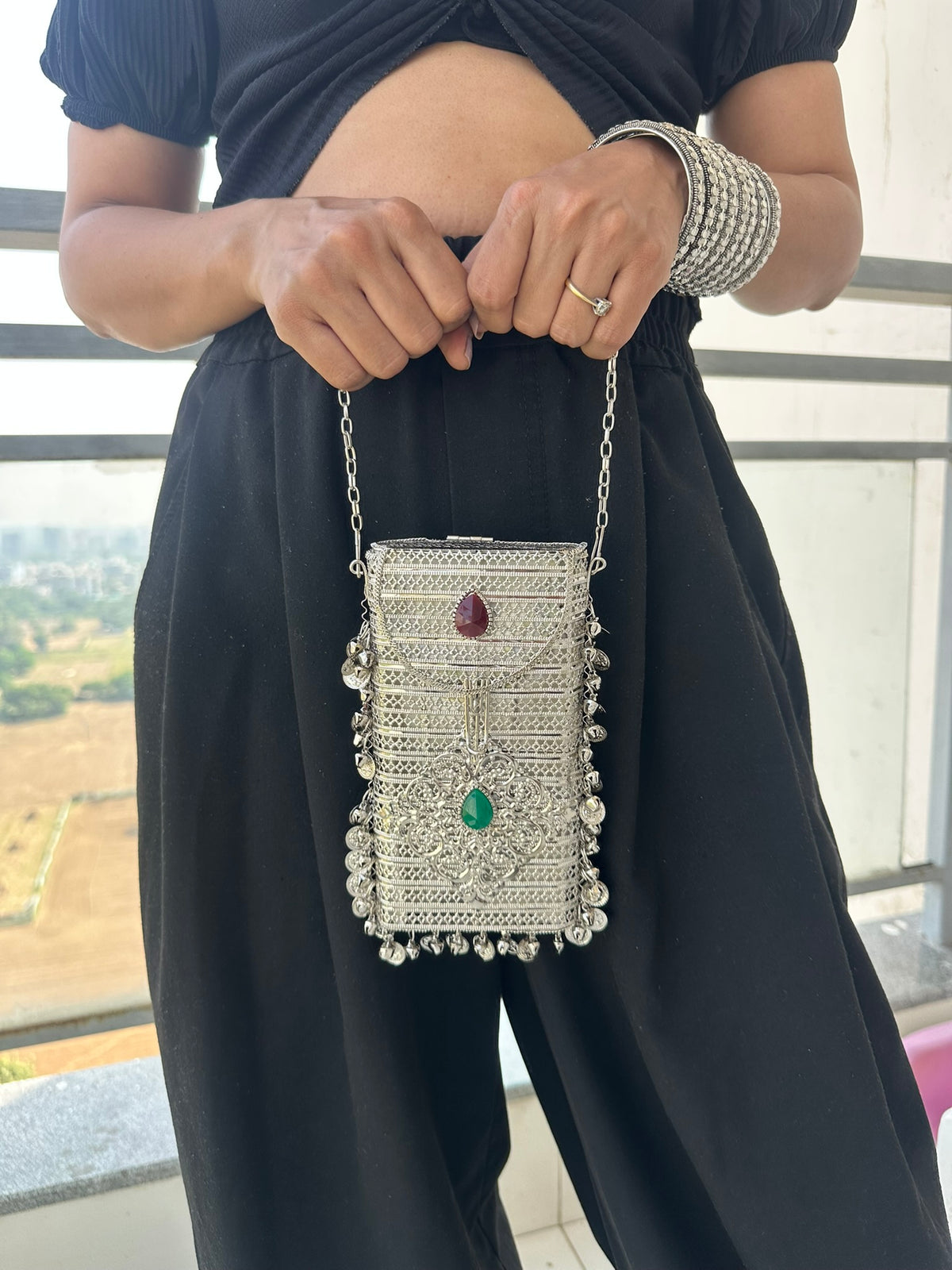 The NAYA Handcrafted Metal Phone Crossbody Clutch with Gemstones & Coin Charms
