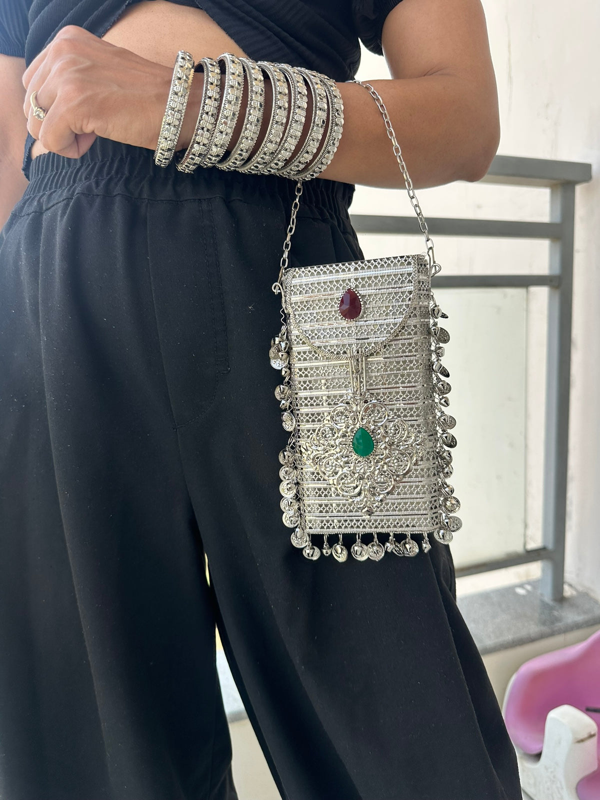 The NAYA Handcrafted Metal Phone Crossbody Clutch with Gemstones & Coin Charms