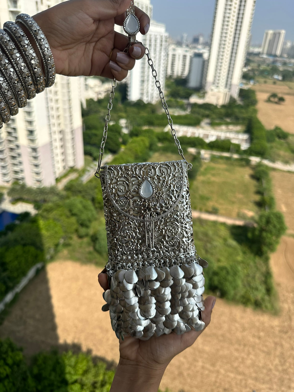 The CHANDI Handcrafted Silver Filigree Phone Crossbody Clutch with Coin Fringe