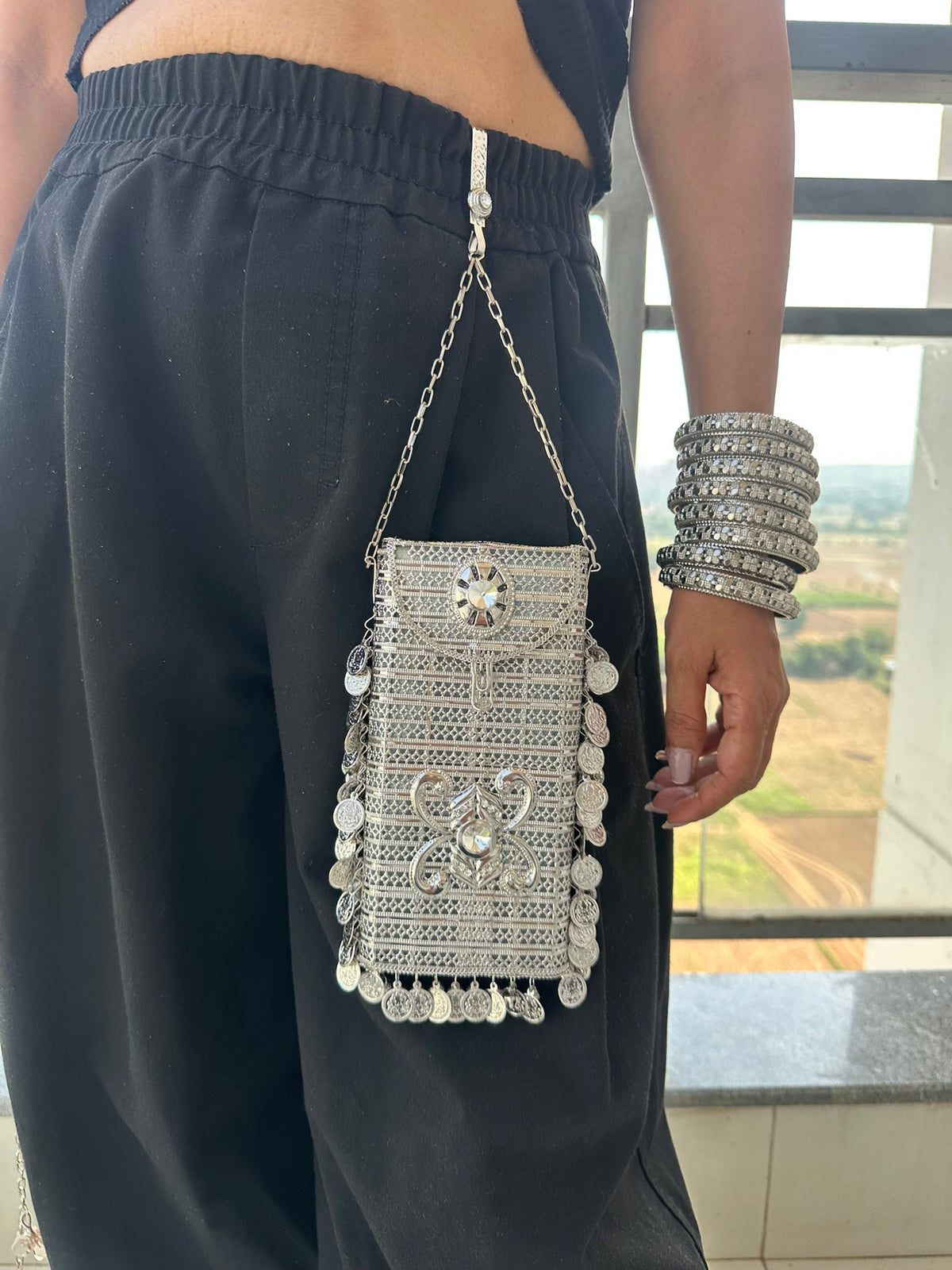 The SITARA Handcrafted Metal Phone Crossbody Clutch with Sunburst Crystal & Coin Charms