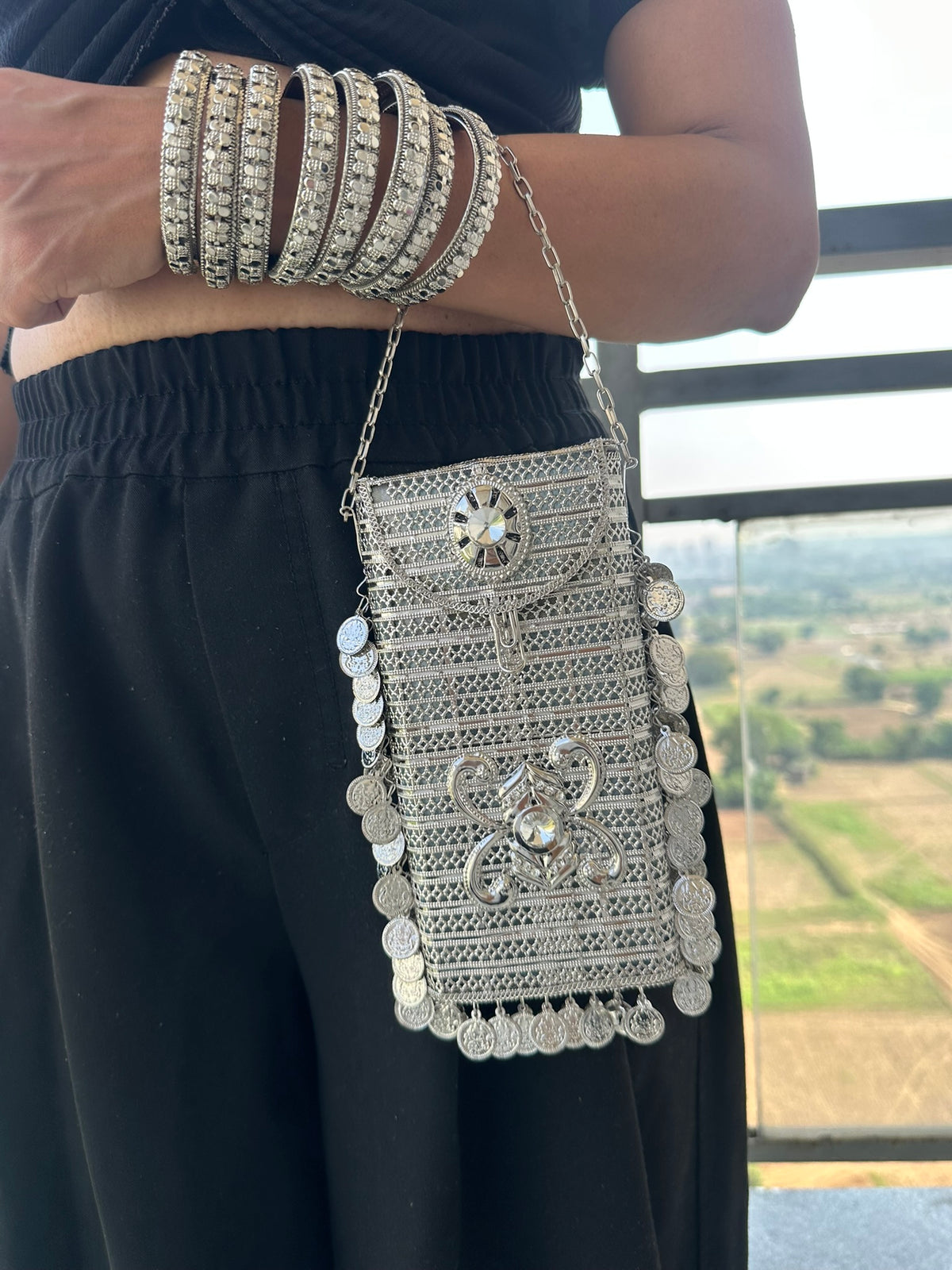The SITARA Handcrafted Metal Phone Crossbody Clutch with Sunburst Crystal & Coin Charms