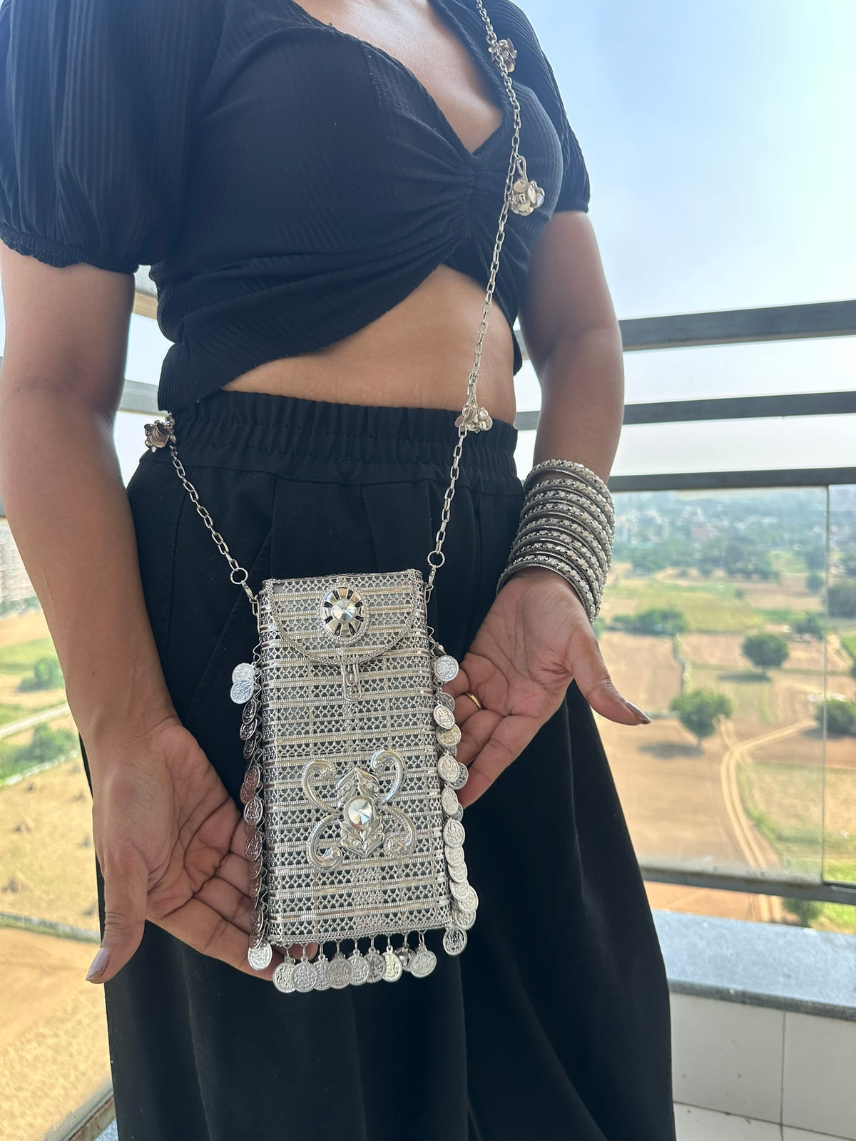 The SITARA Handcrafted Metal Phone Crossbody Clutch with Sunburst Crystal & Coin Charms