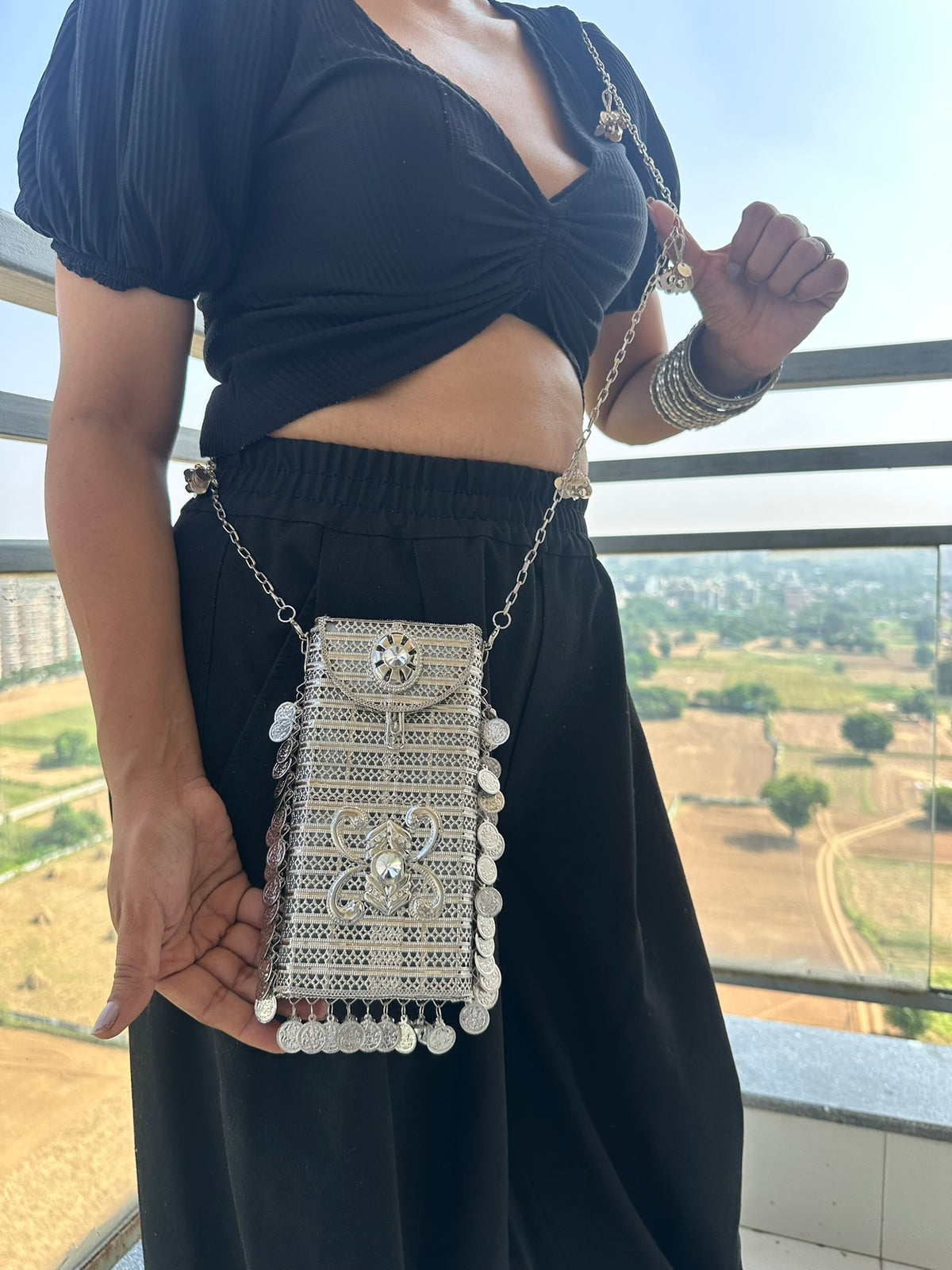 The SITARA Handcrafted Metal Phone Crossbody Clutch with Sunburst Crystal & Coin Charms