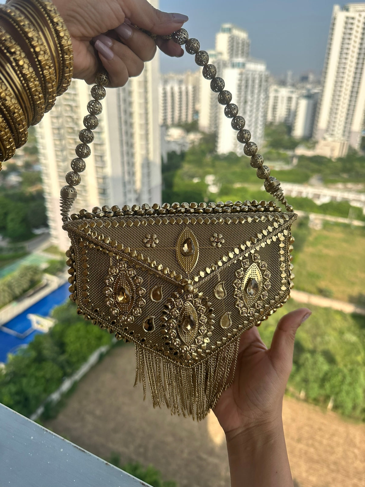 The AANYA Handcrafted Gold Filigree Chevron Envelope Clutch with Chain Fringe
