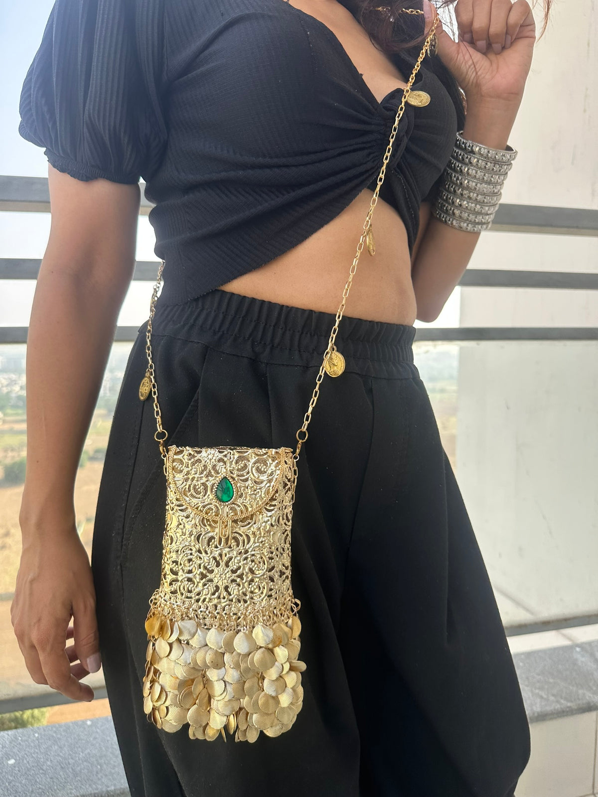 The PAAN Handcrafted Gold Filigree Phone Crossbody Clutch with Emerald Gemstone & Coin Fringe