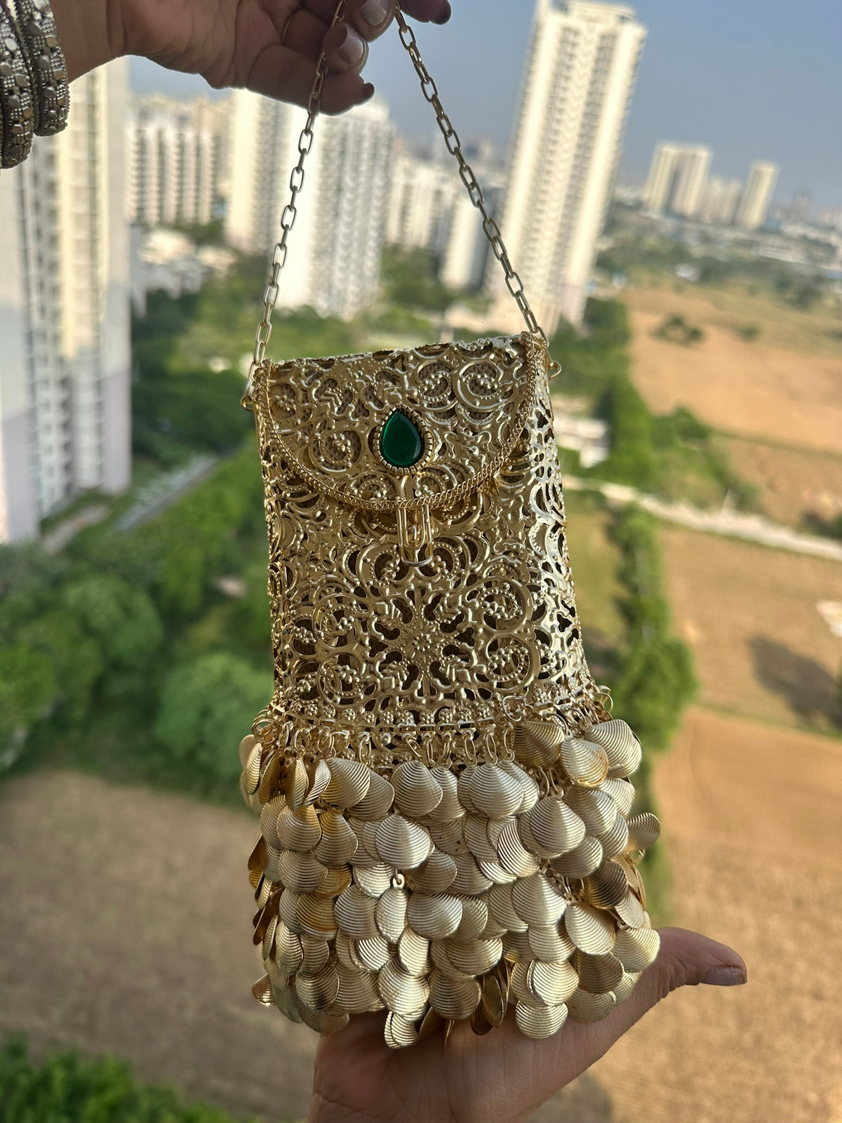 The PAAN Handcrafted Gold Filigree Phone Crossbody Clutch with Emerald Gemstone & Coin Fringe