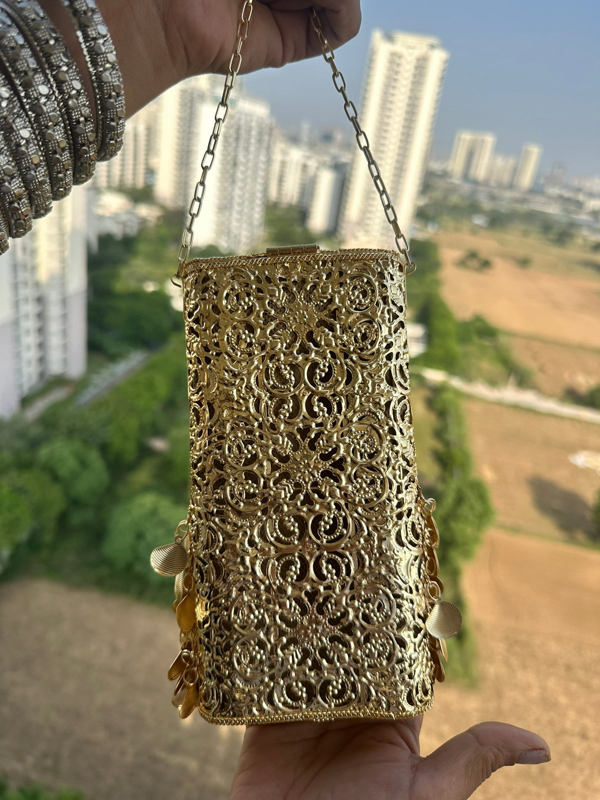 The PAAN Handcrafted Gold Filigree Phone Crossbody Clutch with Emerald Gemstone & Coin Fringe