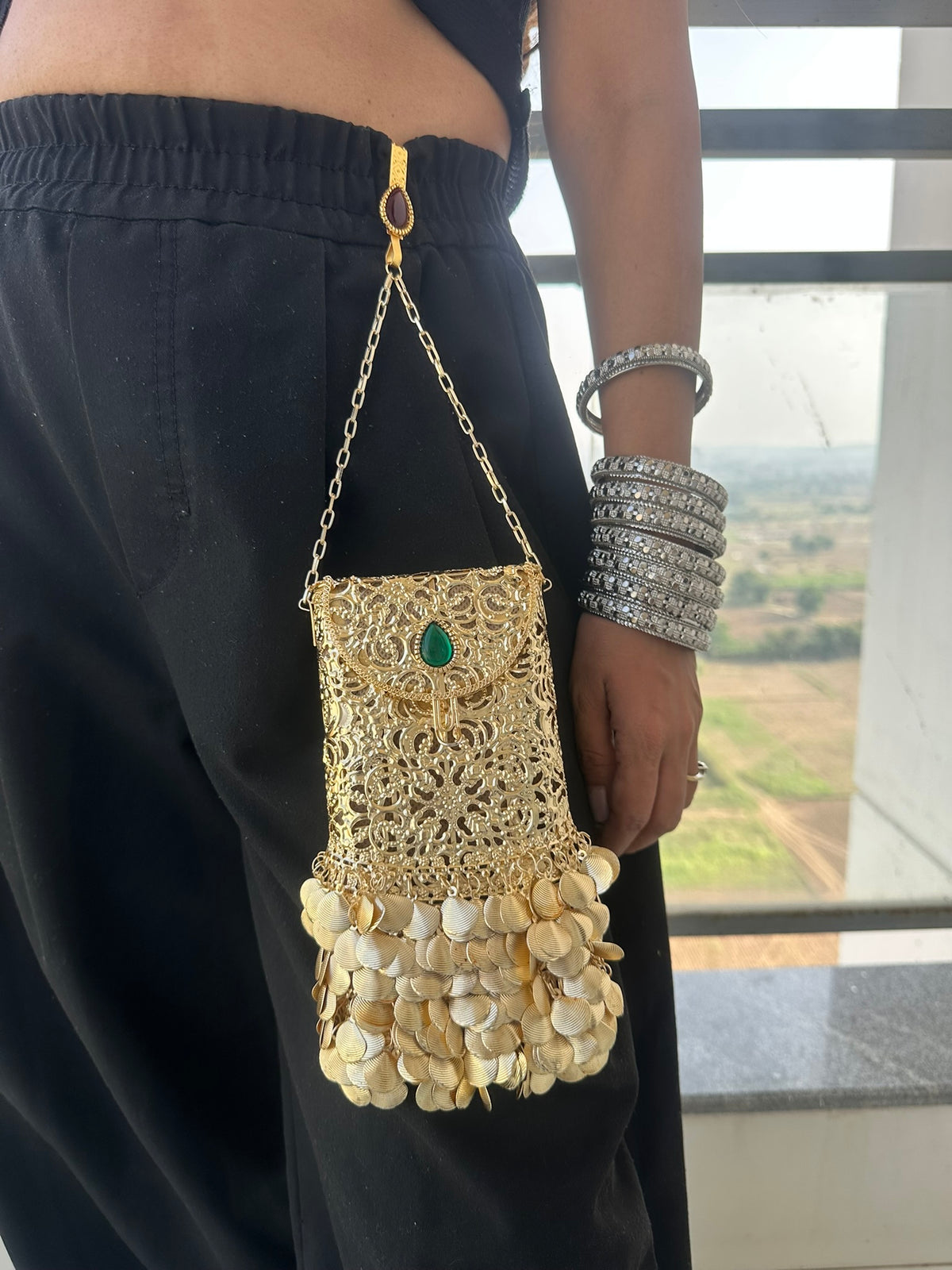 The PAAN Handcrafted Gold Filigree Phone Crossbody Clutch with Emerald Gemstone & Coin Fringe