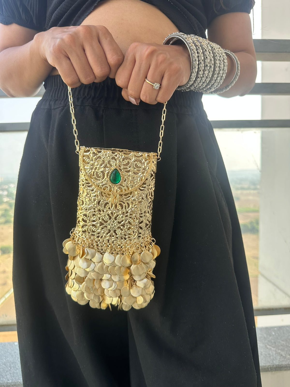 The PAAN Handcrafted Gold Filigree Phone Crossbody Clutch with Emerald Gemstone & Coin Fringe