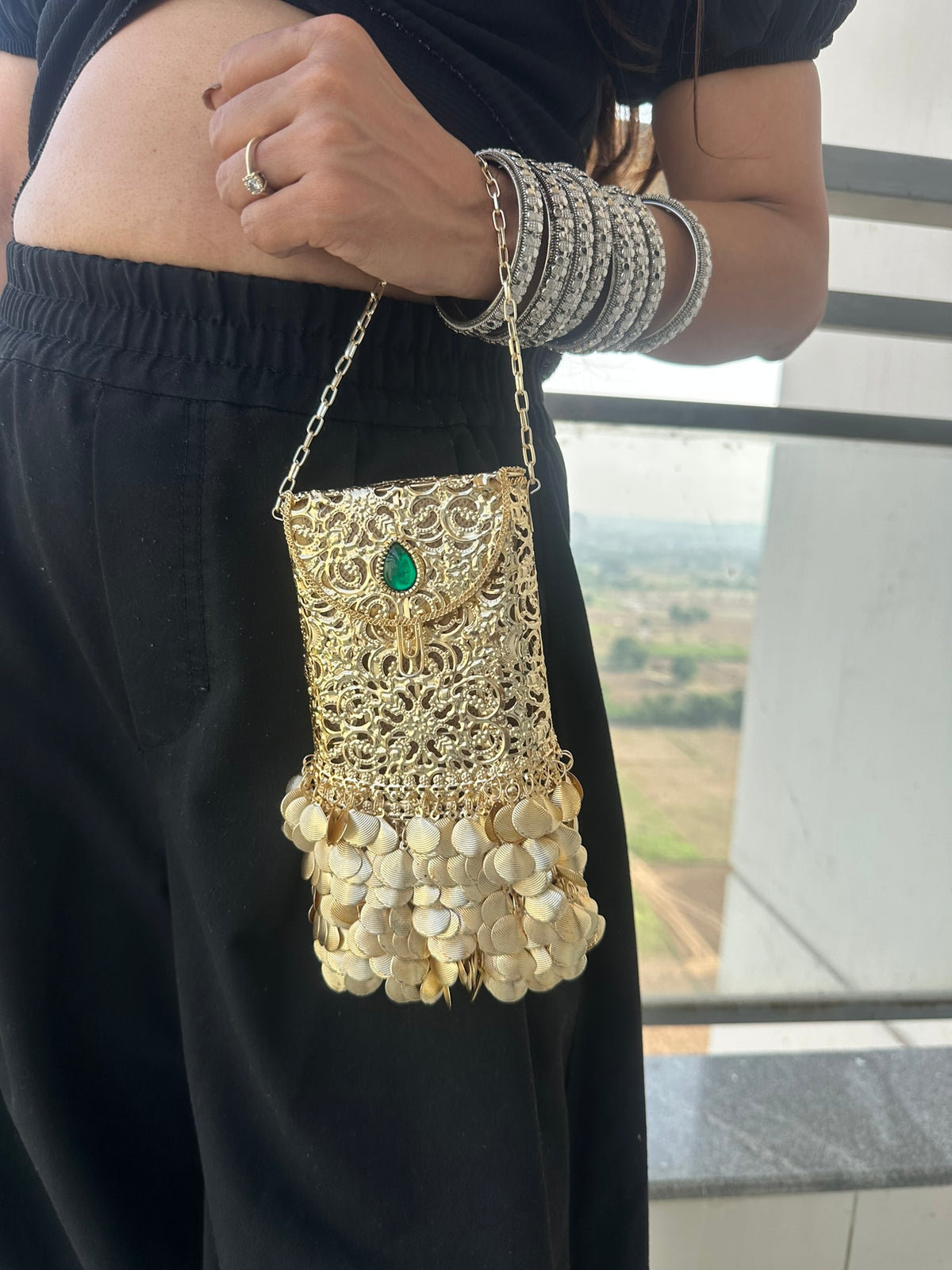 The PAAN Handcrafted Gold Filigree Phone Crossbody Clutch with Emerald Gemstone & Coin Fringe
