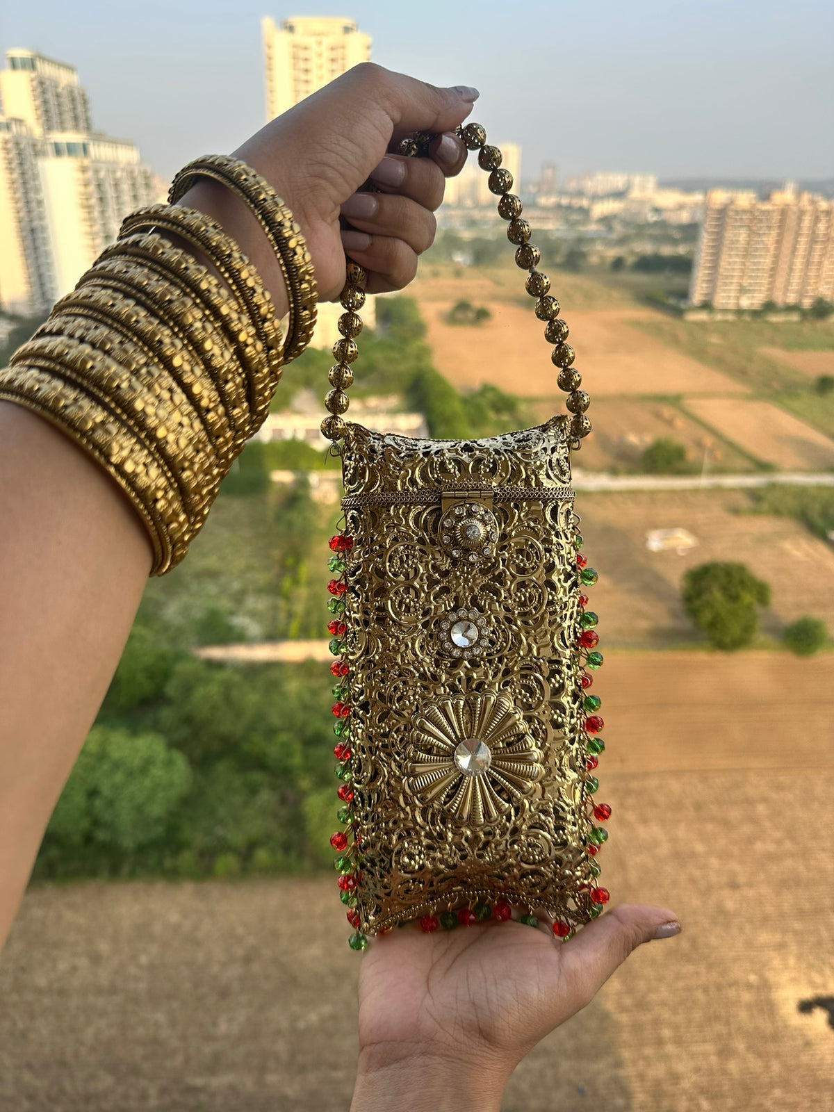 The AMEERA Handcrafted Gold Filigree Phone Clutch with Dual Straps