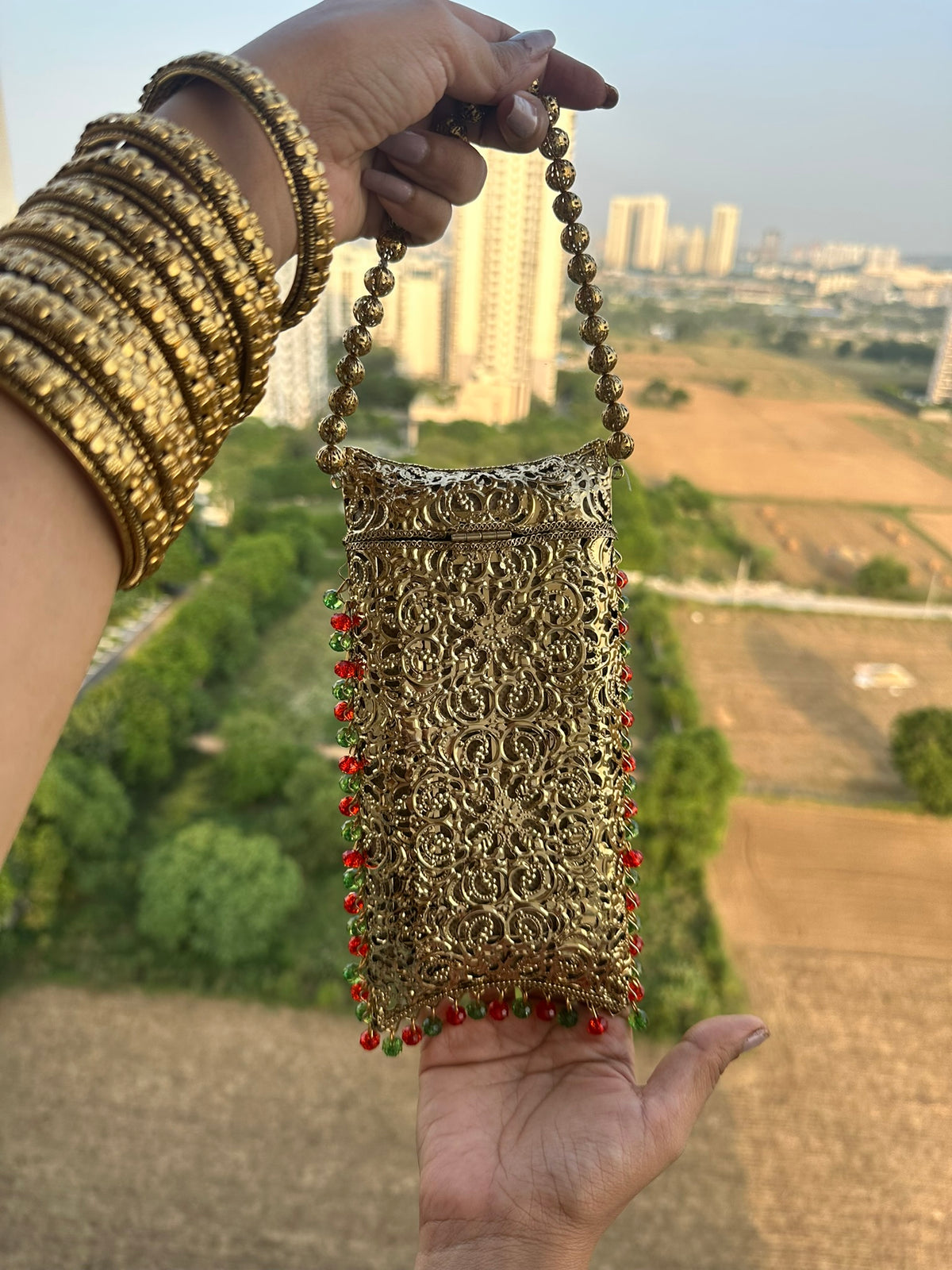 The AMEERA Handcrafted Gold Filigree Phone Clutch with Dual Straps