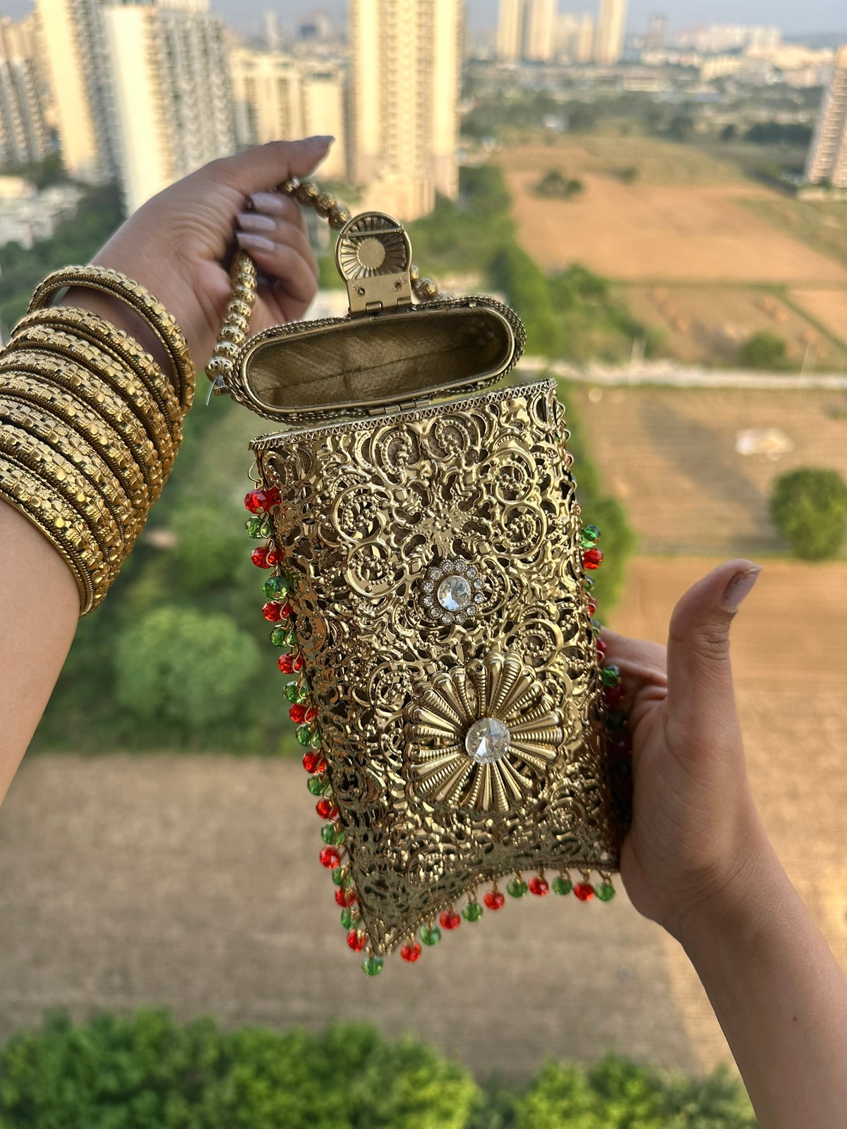 The AMEERA Handcrafted Gold Filigree Phone Clutch with Dual Straps