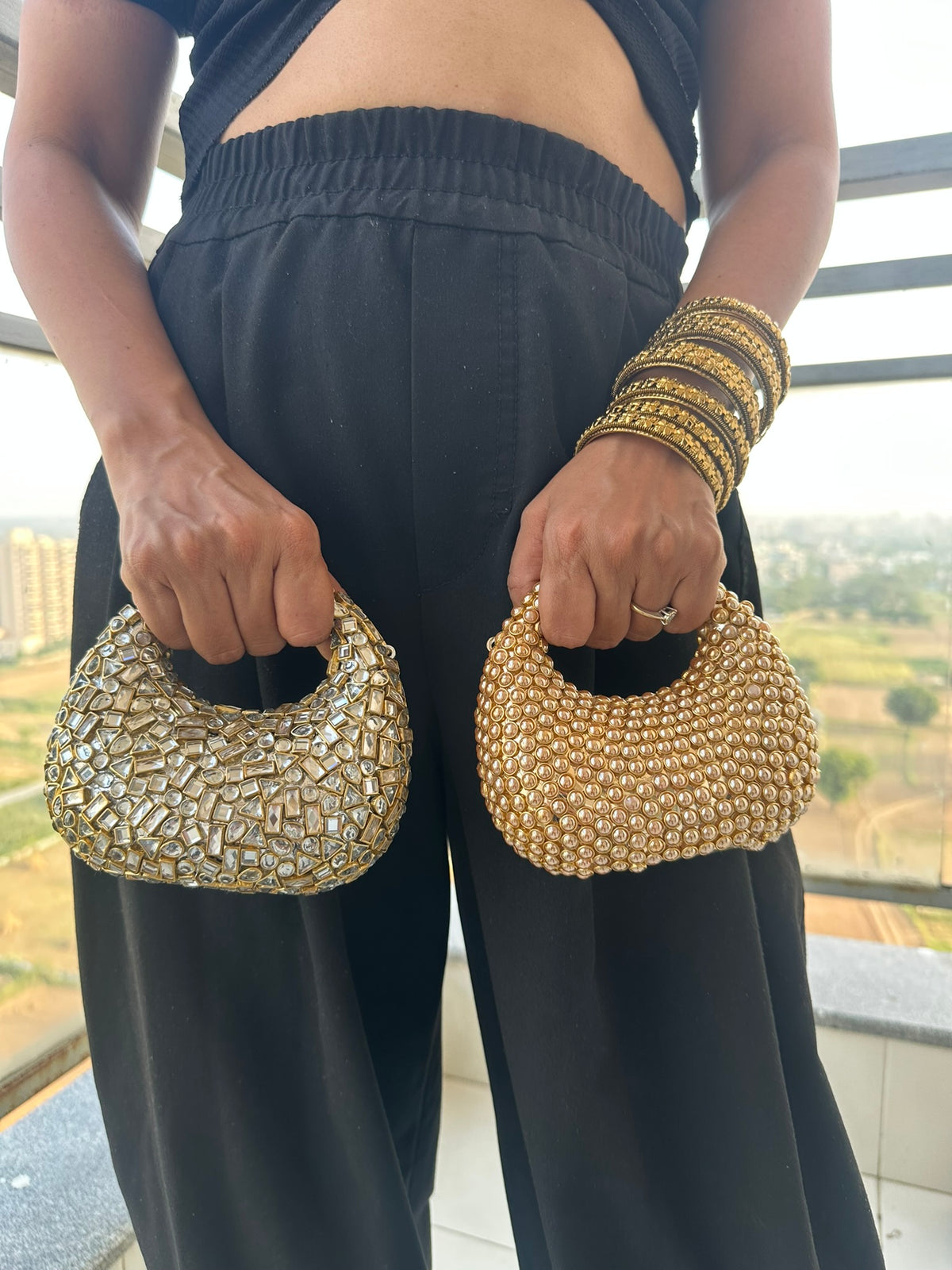 The TARA Handcrafted Mini Crescent Top-Handle Clutch with Charm Sling