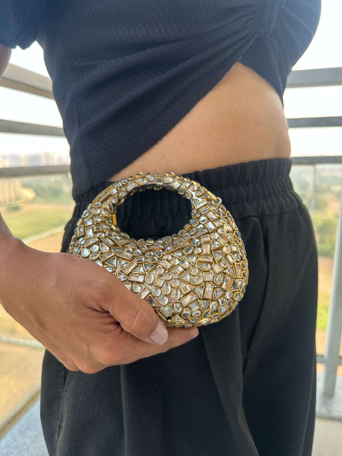 The TARA Handcrafted Mini Crescent Top-Handle Clutch with Charm Sling