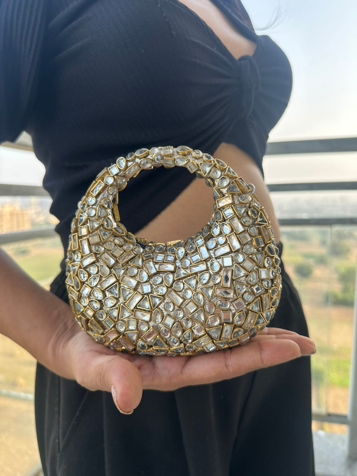 The TARA Handcrafted Mini Crescent Top-Handle Clutch with Charm Sling