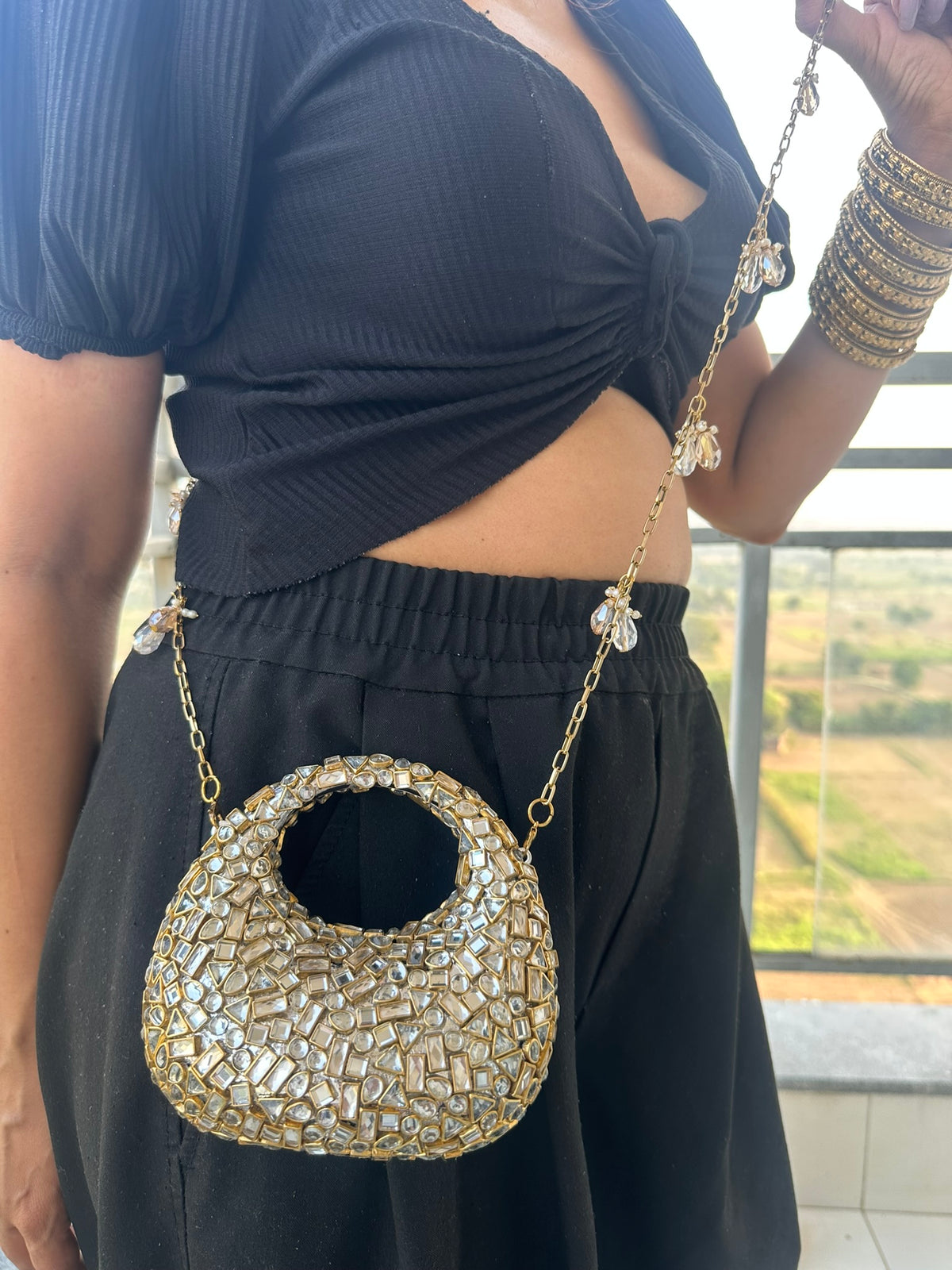 The TARA Handcrafted Mini Crescent Top-Handle Clutch with Charm Sling