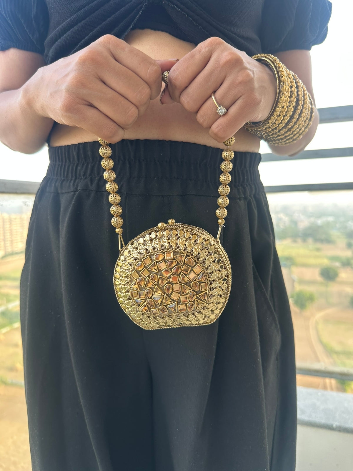 The KAVYA Handcrafted Antique Gold Oval Filigree & Amber Mirror Clutch