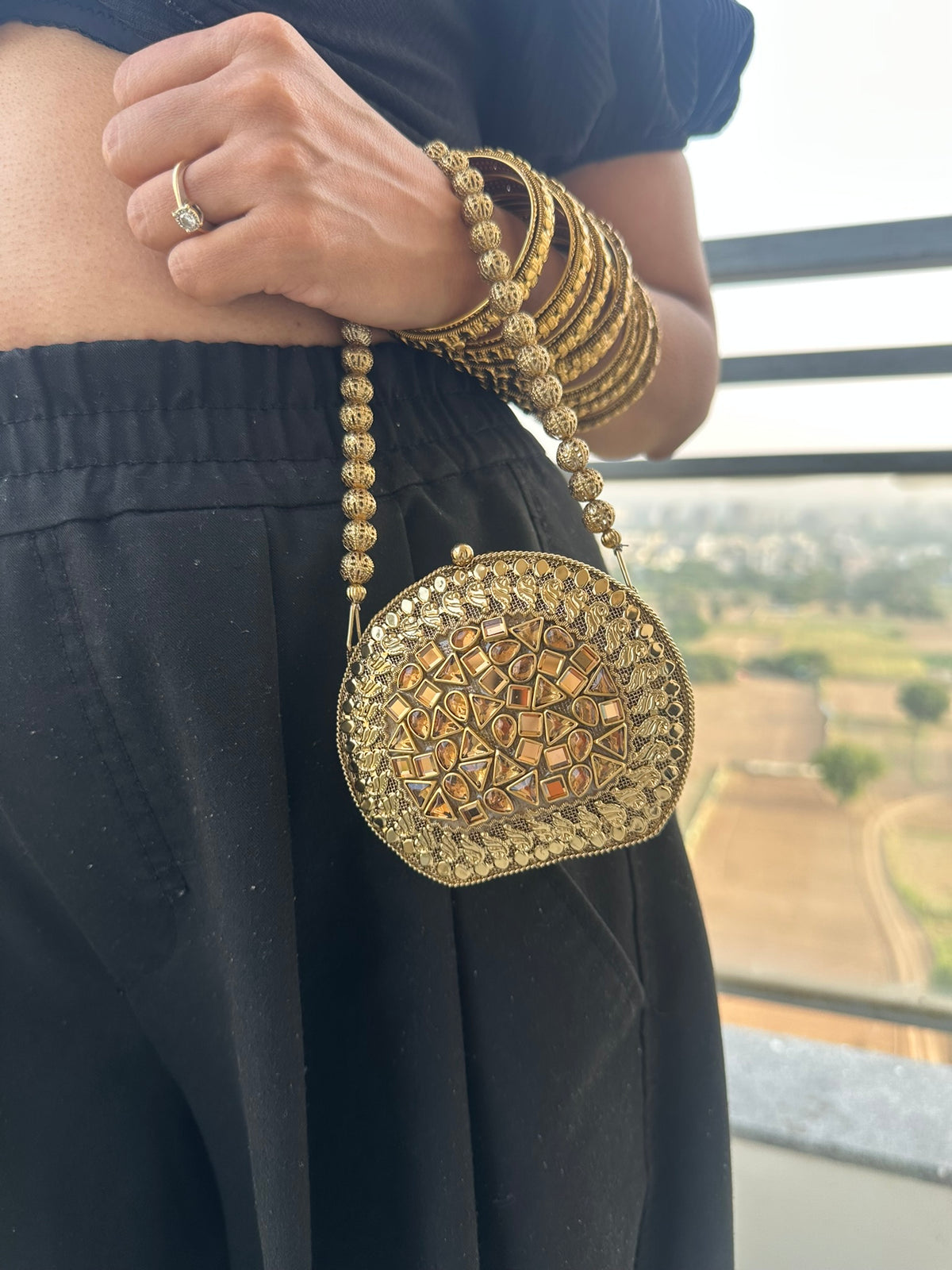 The KAVYA Handcrafted Antique Gold Oval Filigree & Amber Mirror Clutch